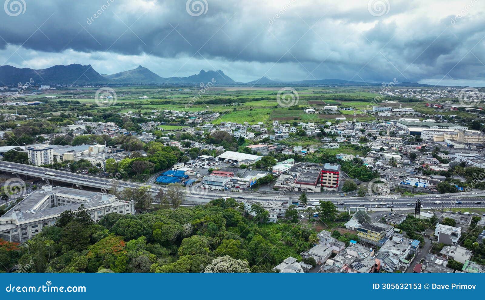 aerial view of quatre bornes city with mountains in the background