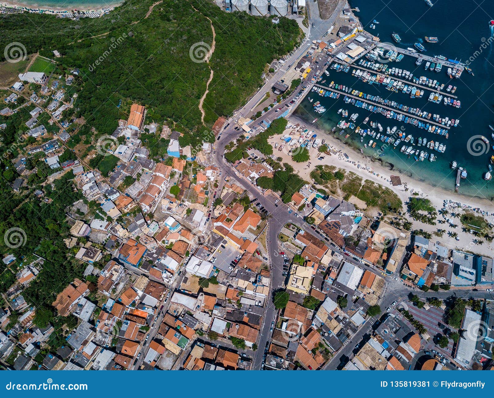 aerial photo city, ocean and mountains. view from the top to streets of arraial do cabo brazilian state of rio de
