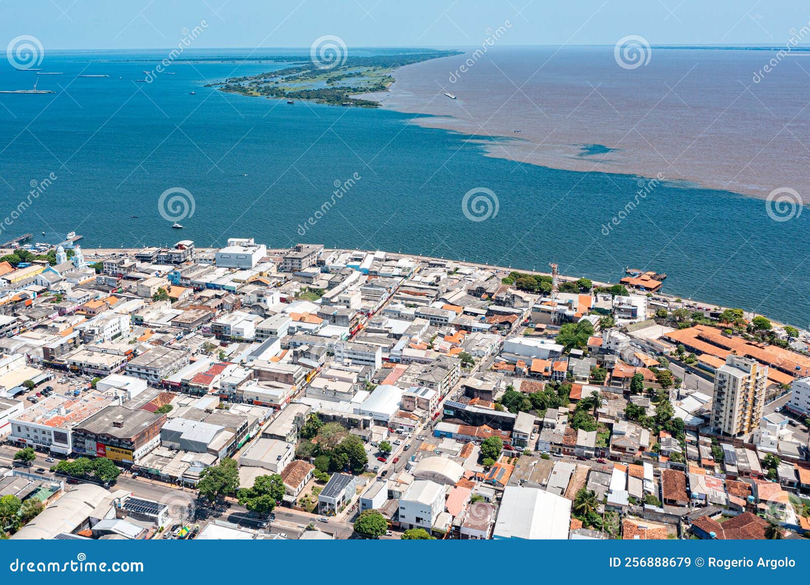 aerial photo of satarÃÂ©m city and the meeting of the waters of the amazon rivers with the tapajÃÂ³s river in parÃÂ¡, brazil.