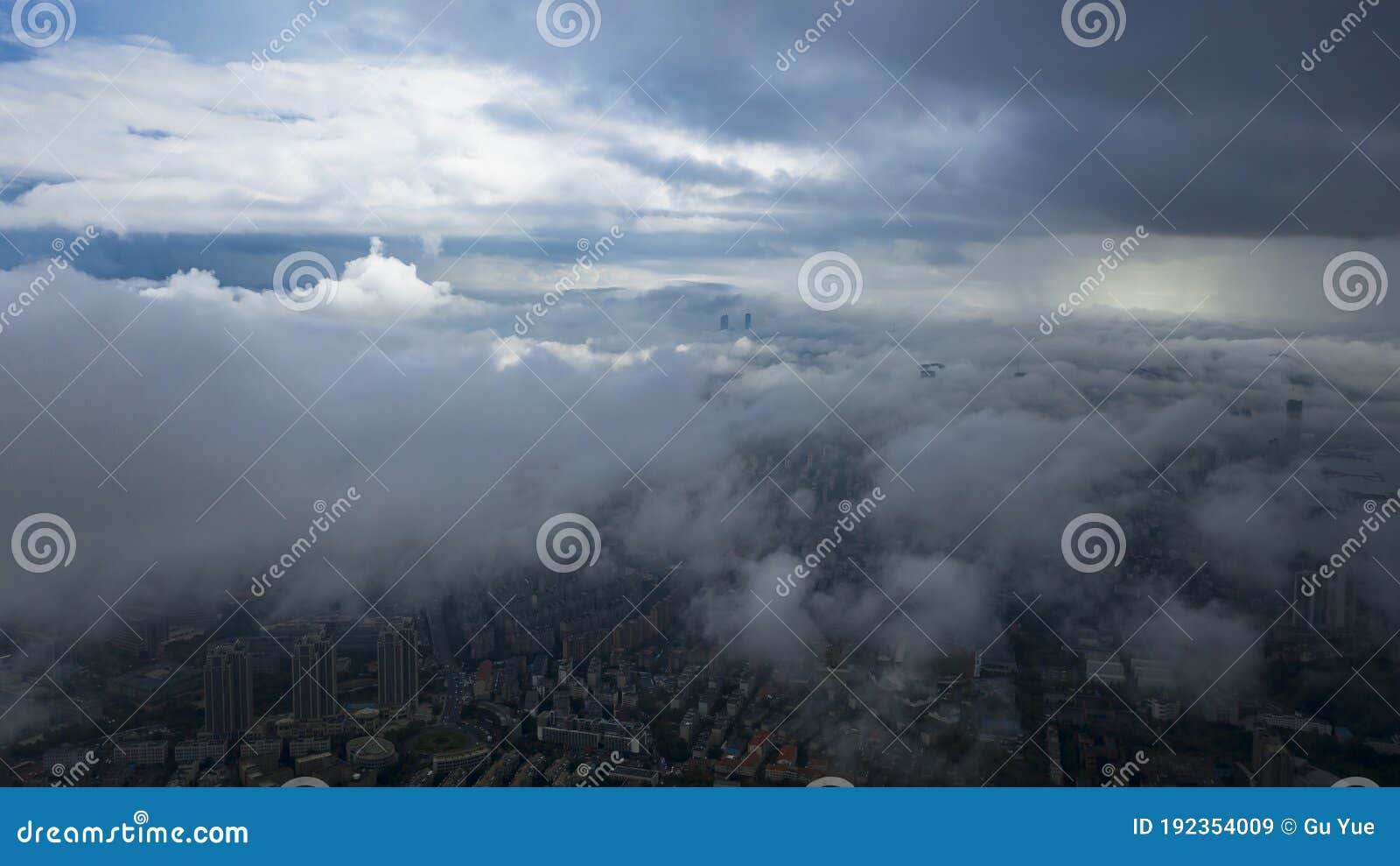 aerial photography of chinaÃ¢â¬â¢s seaside second-tier cities under clouds and fog, and the sea-crossing bridge over the sea