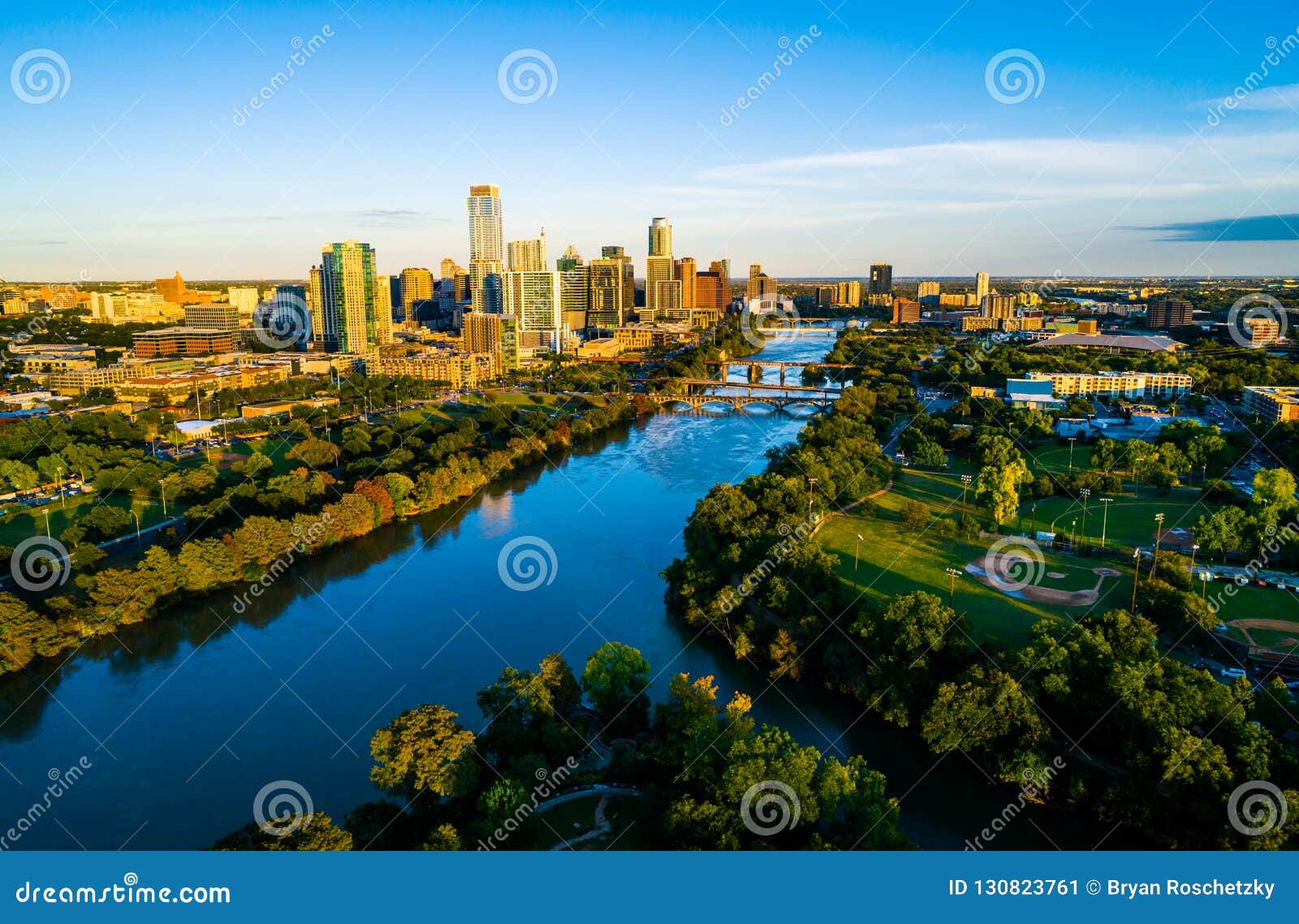 aerial rone view of austin texas golden hour sunset over town lake