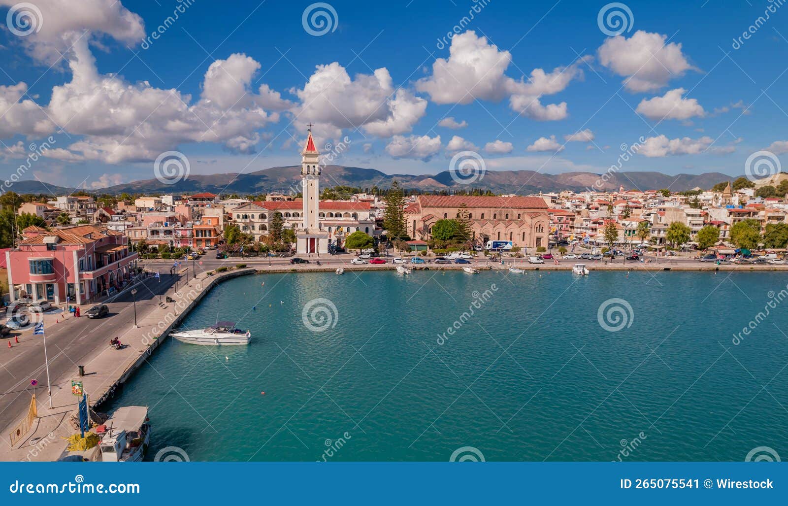 aerial of saint dionisios church with zakynthos port on a sunny day