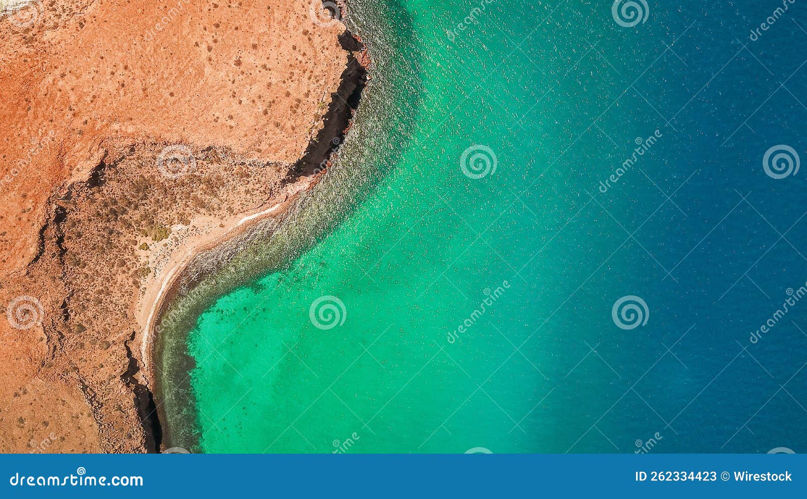 aerial shot of blue-green waters in isla del espiritu santo, baja california sur, mexico