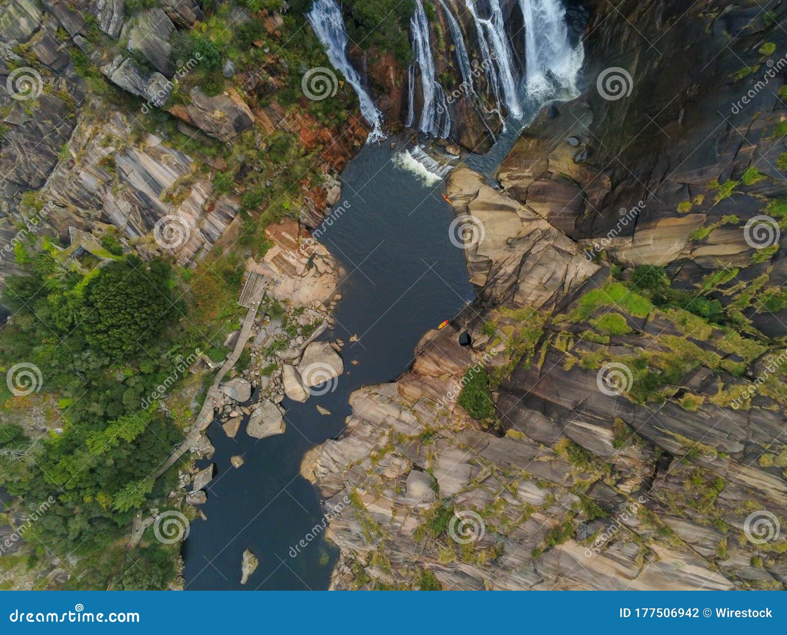 aerial shot of the ezaro waterfall in galicia, spain