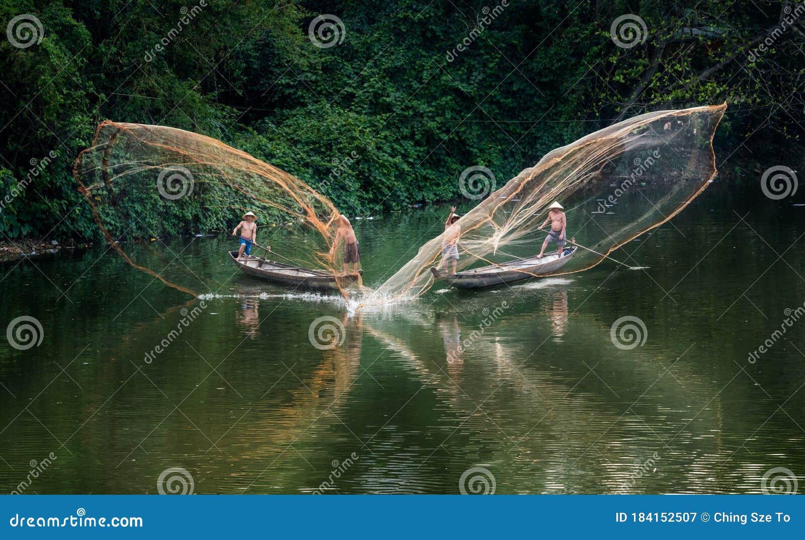 An Aerial Shot of Four Vietnamese Fisherman Throwing Fishnets from Two Boats  on the Song Nhu Y River Editorial Photography - Image of asian, floating:  184152507