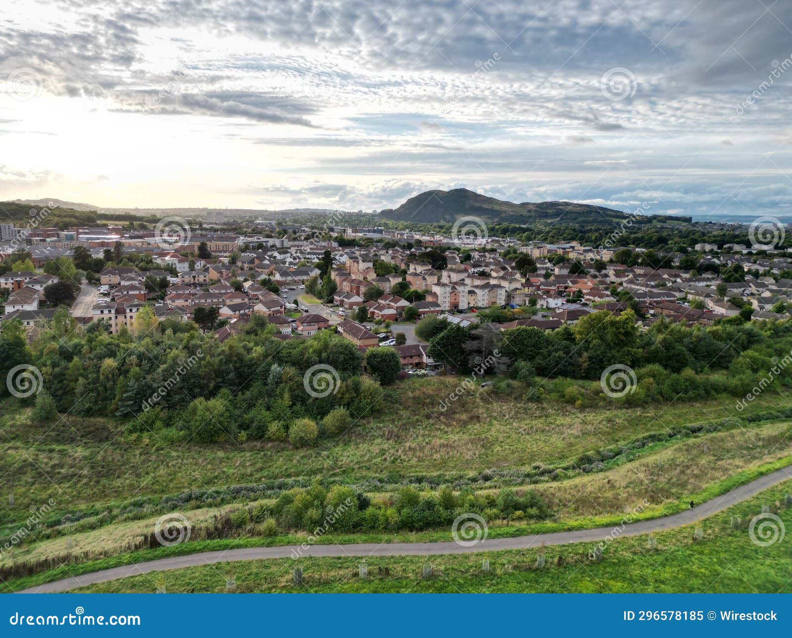 the aerial shot of a town in england, taken from the top of a hill