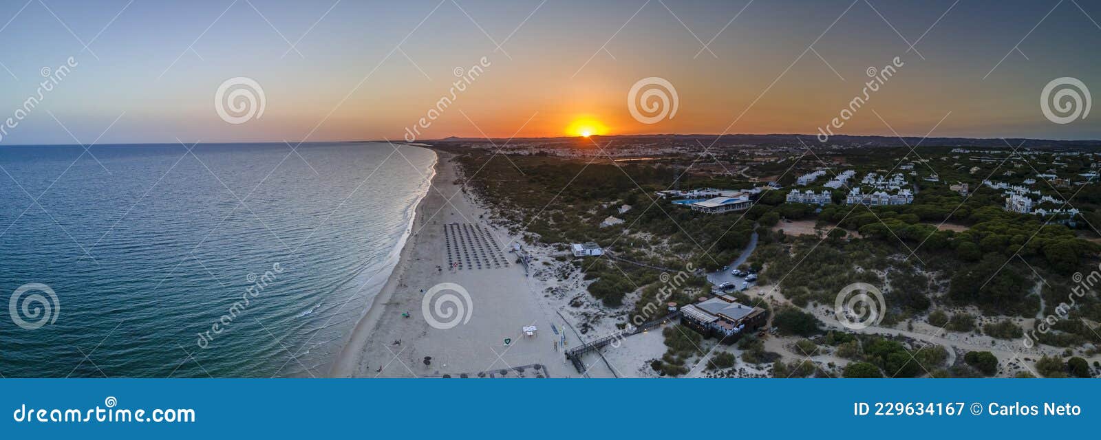 aerial sunset seascape of famous altura beach, algarve