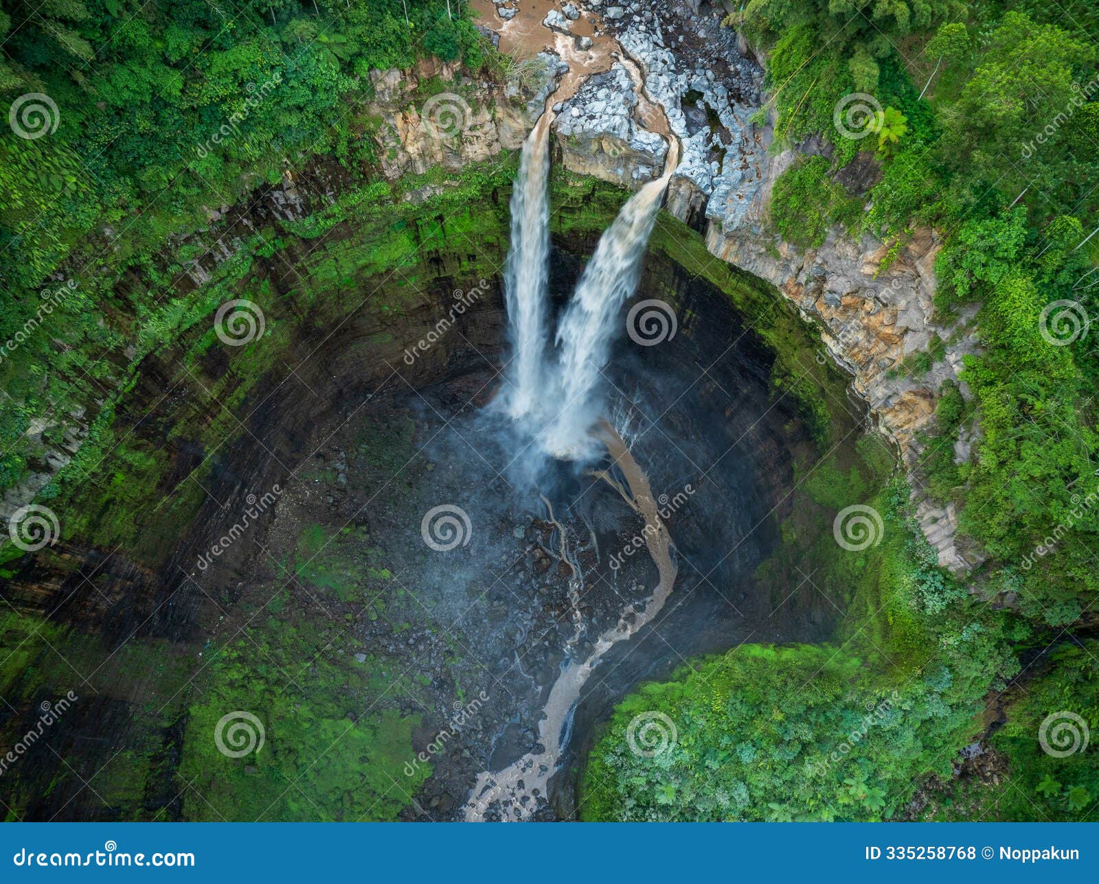 aerial top view from above of tumpak sewu waterfall, indonesia, high waterfall in malang regency, east