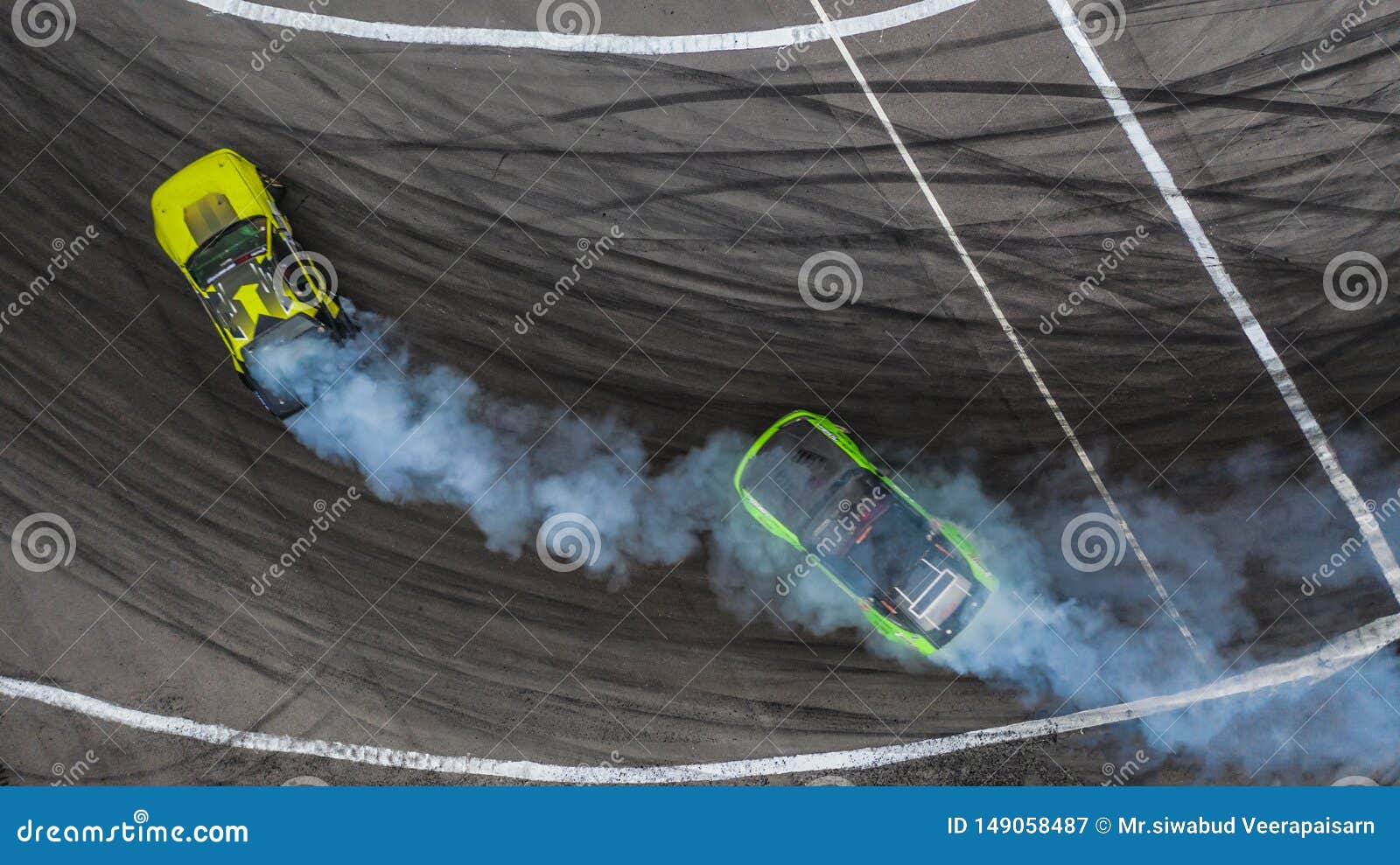 Aerial Top View Two Cars Drifting Battle On Asphalt Race Track With Lots Of  Smoke From Burning Tires, Two Race Cars Competition Drift Battle View From  Above. Stock Photo, Picture and Royalty
