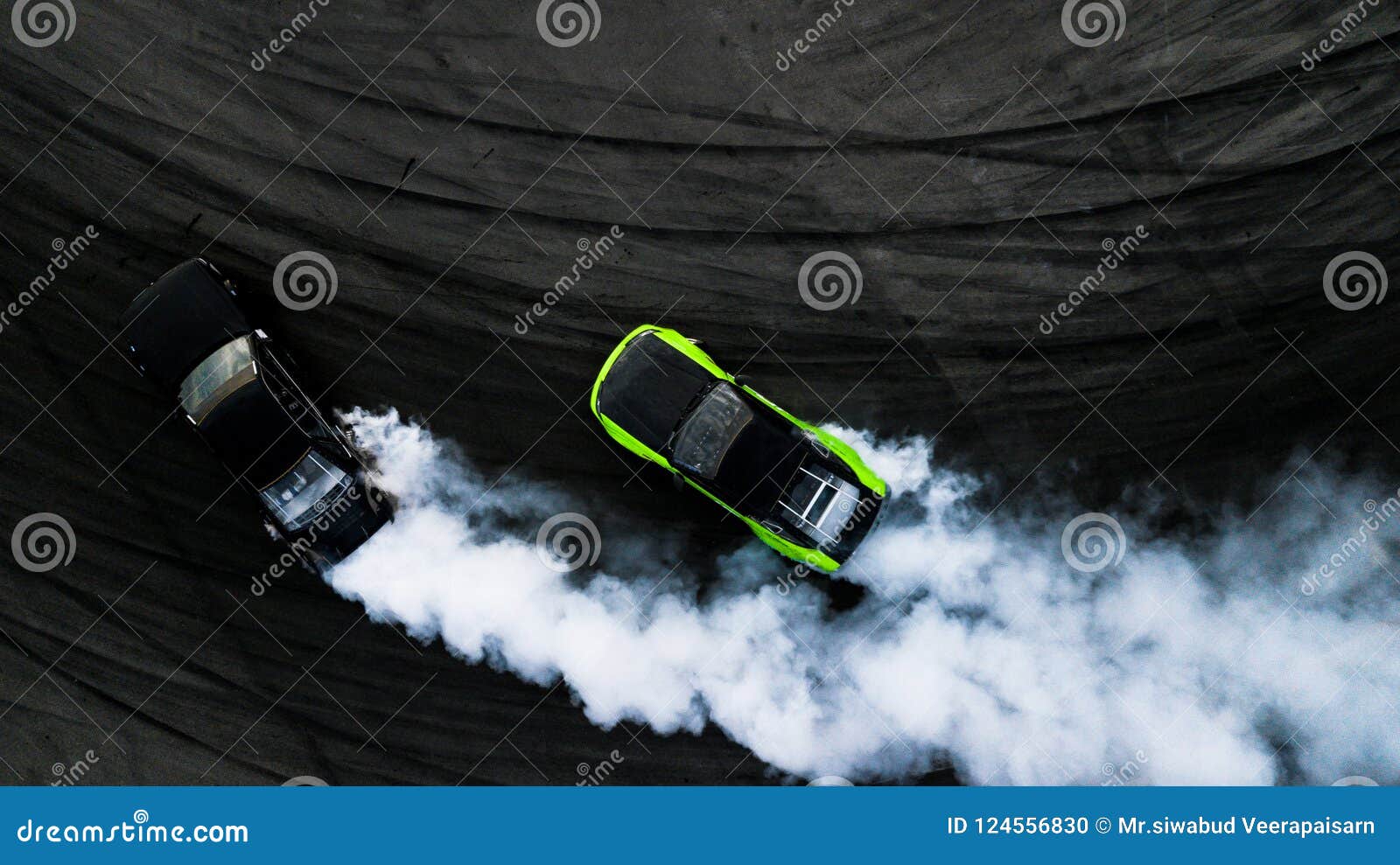 Aerial Top View Two Cars Drifting Battle On Asphalt Race Track With Lots Of  Smoke From Burning Tires, Two Race Cars Competition Drift Battle View From  Above. Stock Photo, Picture and Royalty