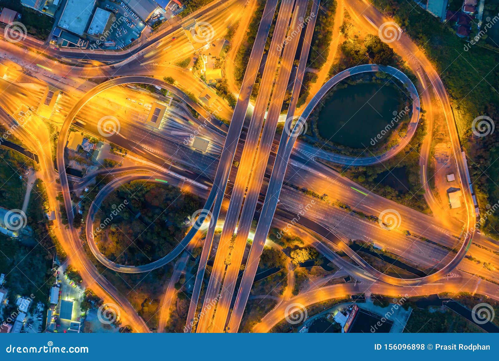 aerial view above of busy highway road junctions at day. the intersecting freeway road overpass the eastern outer ring road of