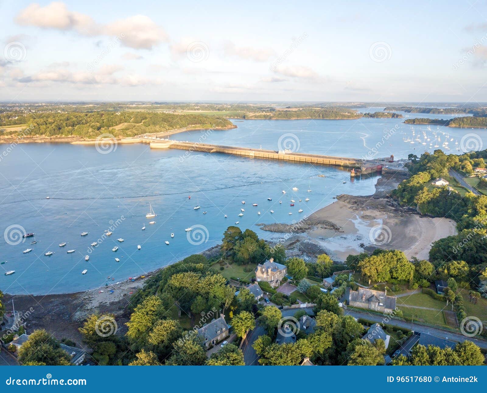 aerial view on barrage de la rance in brittany close to saint malo, tidal energy at sunset