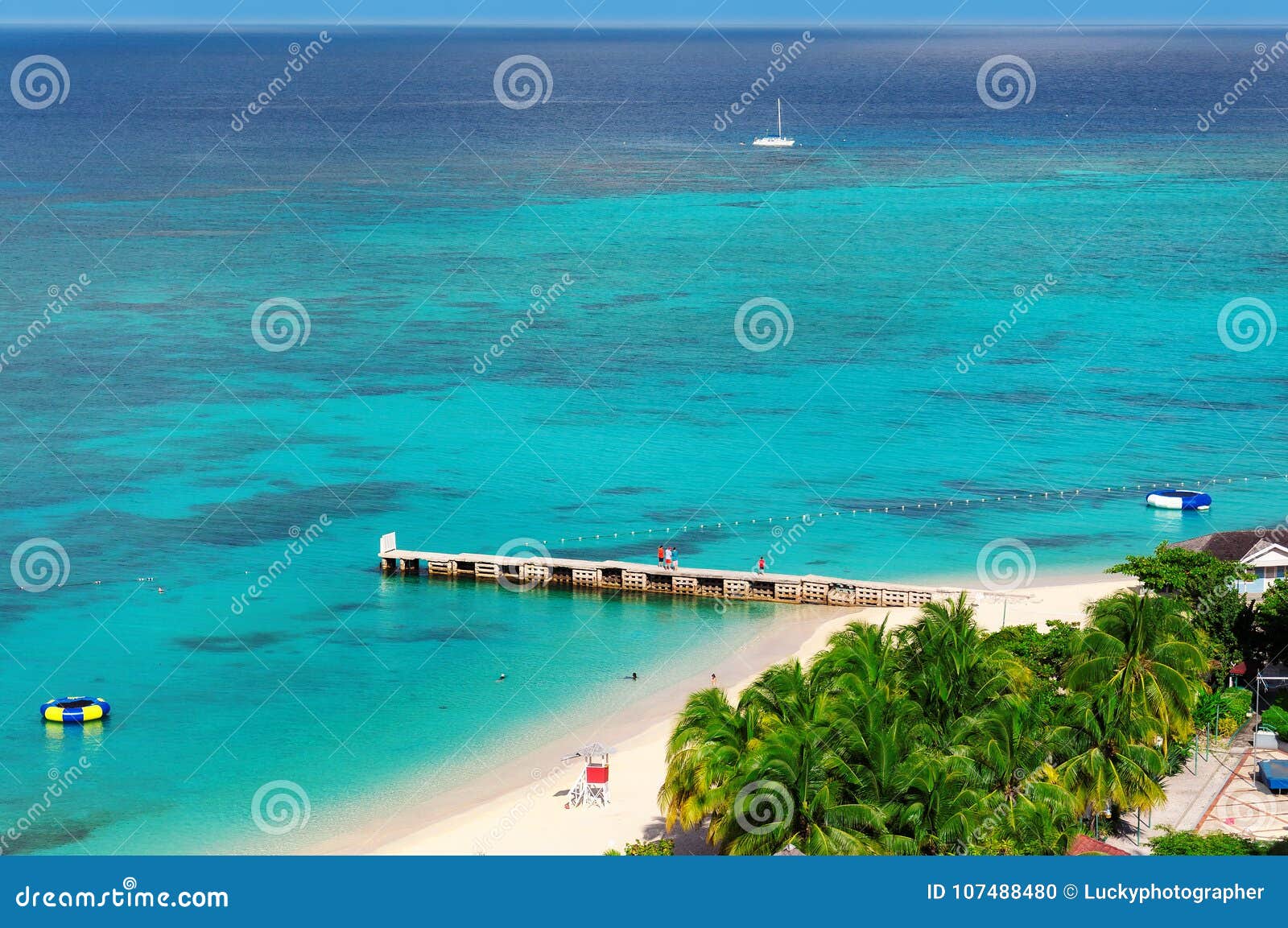 aerial view on beautiful caribbean beach and pier in montego bay, jamaica island.