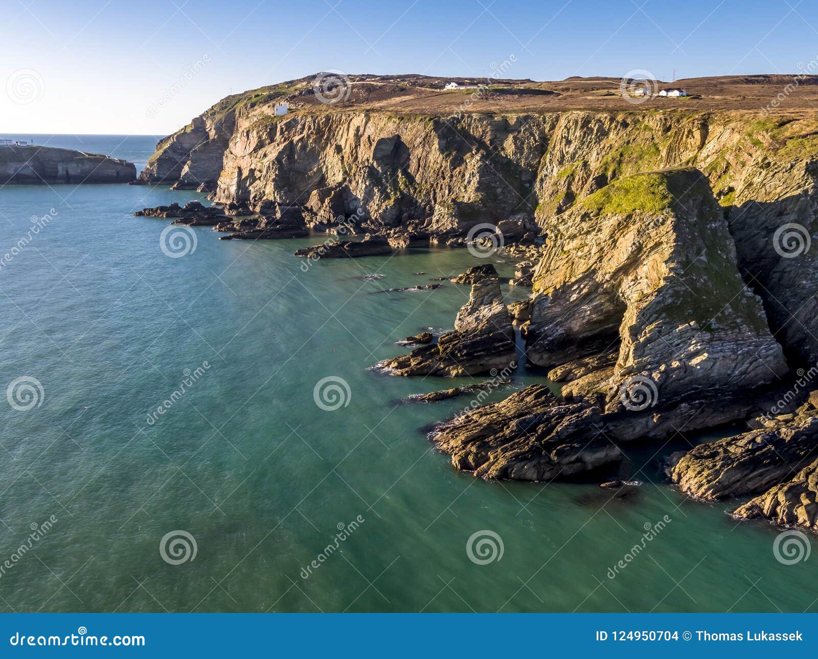 aerial view of the beautiful cliffs close to the historic south stack lighthouse on anglesey - wales