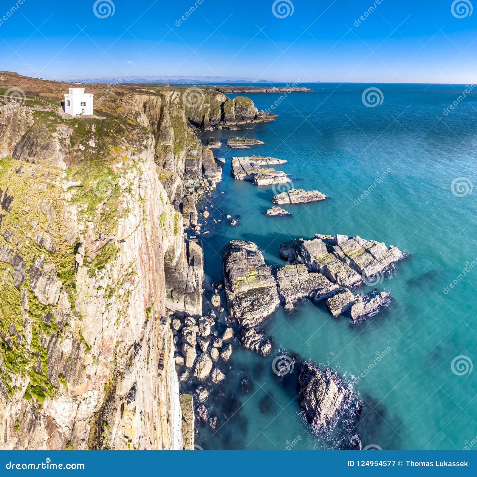 aerial view of the beautiful cliffs close to the historic south stack lighthouse on anglesey - wales