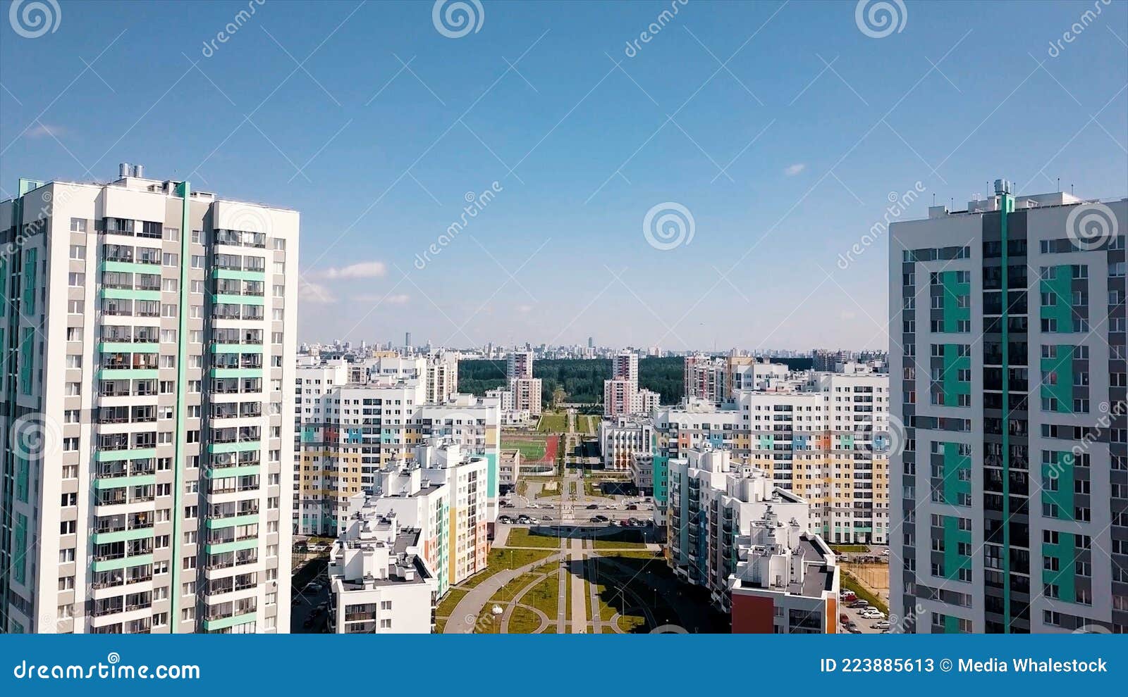 Aerial View of a Big City District with Sunny Streets and High Rise  Residential Buildings on Blue Sky Background. Video Stock Image - Image of  development, area: 223885613