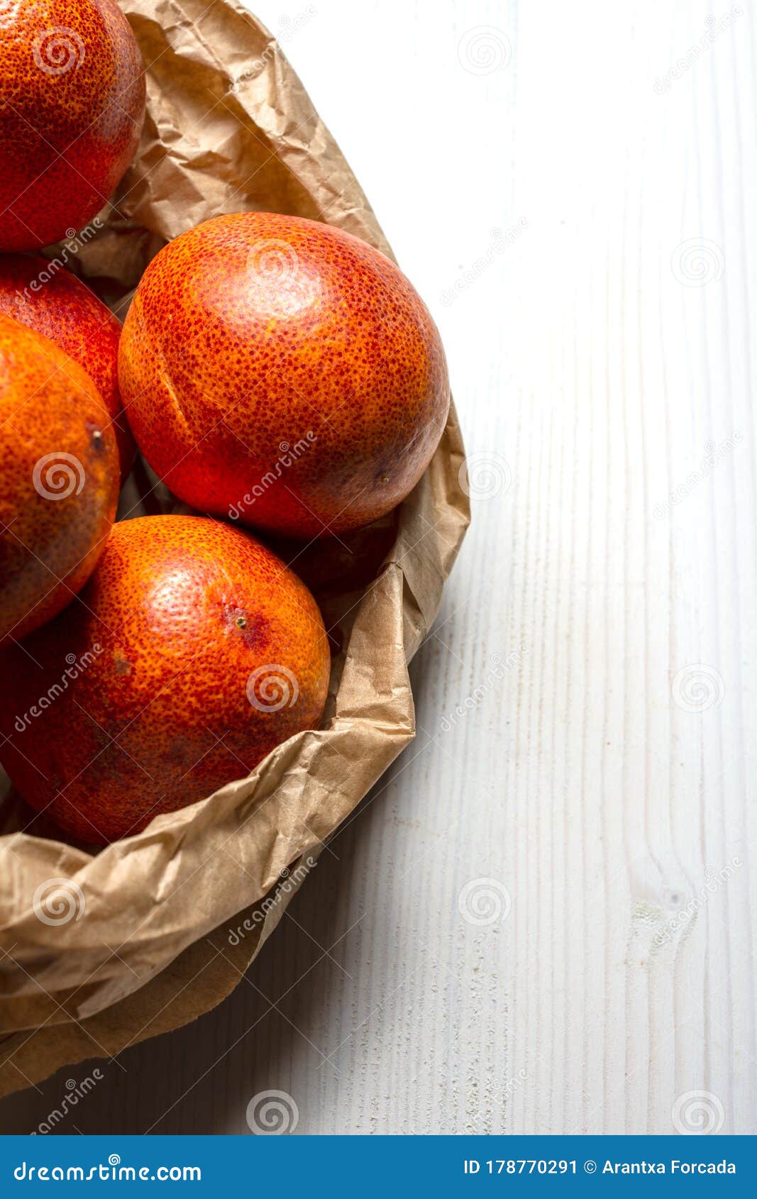 Aerial View of Blood Oranges in Paper Bag on White Wooden Table in ...