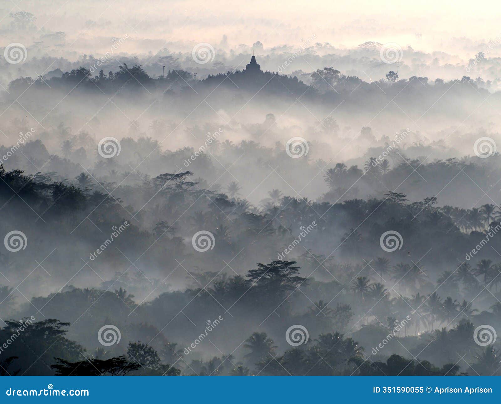an aerial view of borobudur temple in a foggy and misty morning