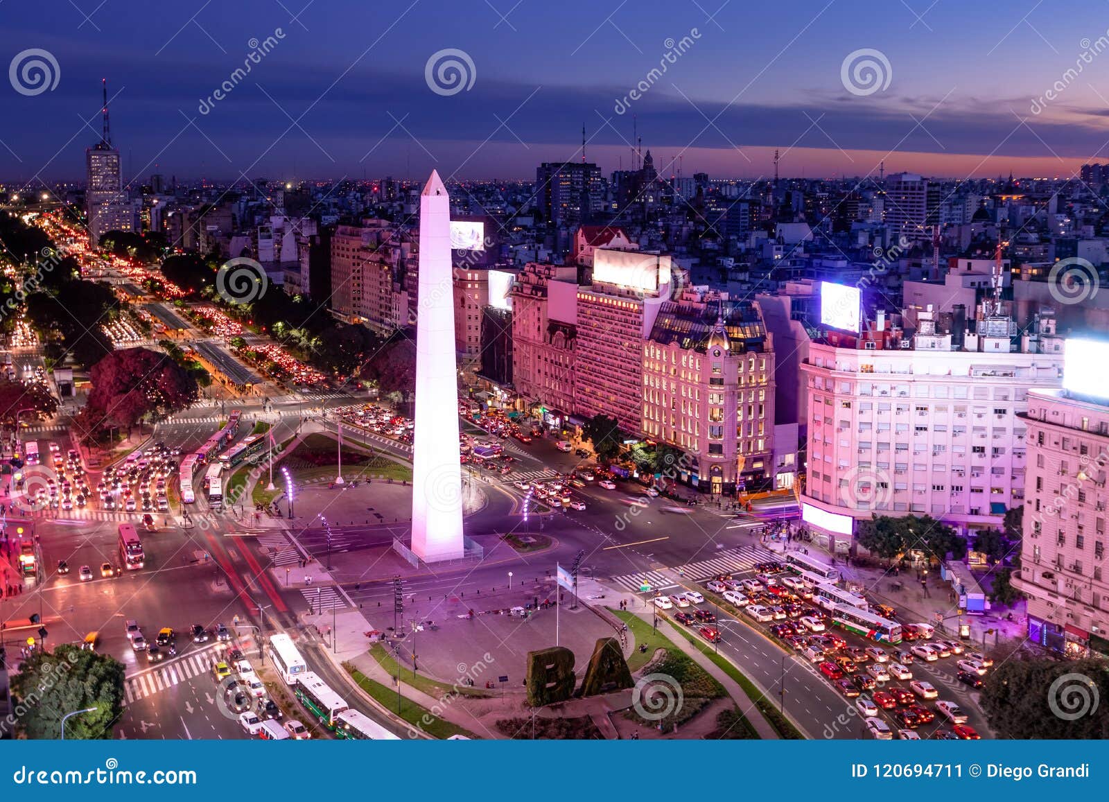 aerial view of buenos aires and 9 de julio avenue at night with purple light - buenos aires, argentina