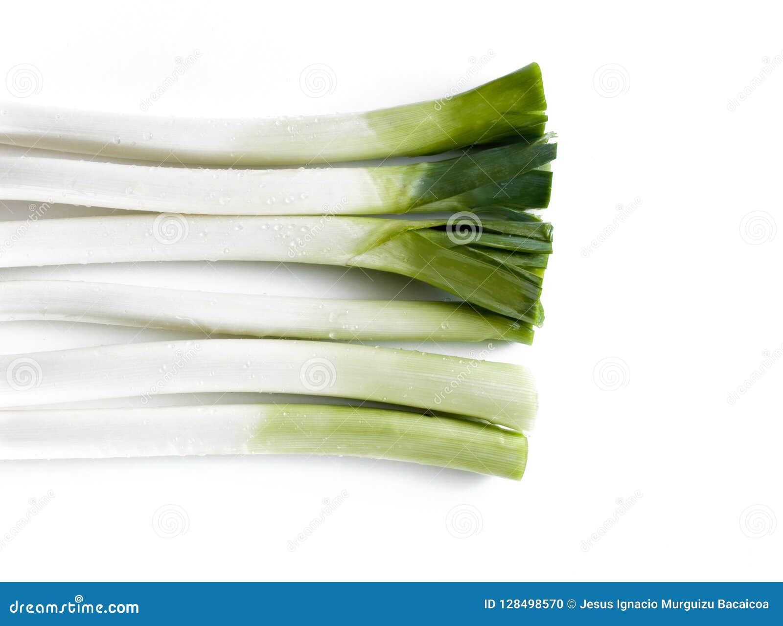 aerial view of a bunch of leeks on a white table