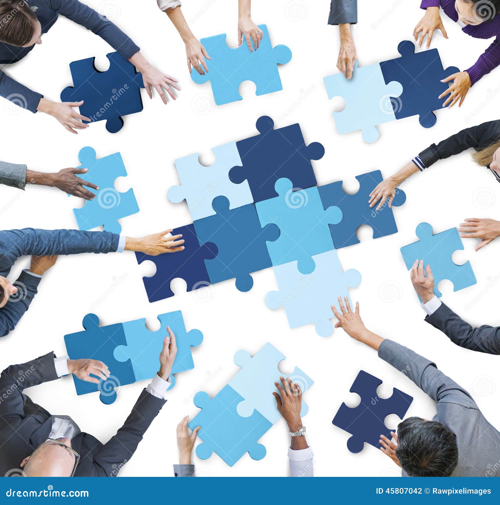 aerial view of business people piecing puzzle pieces