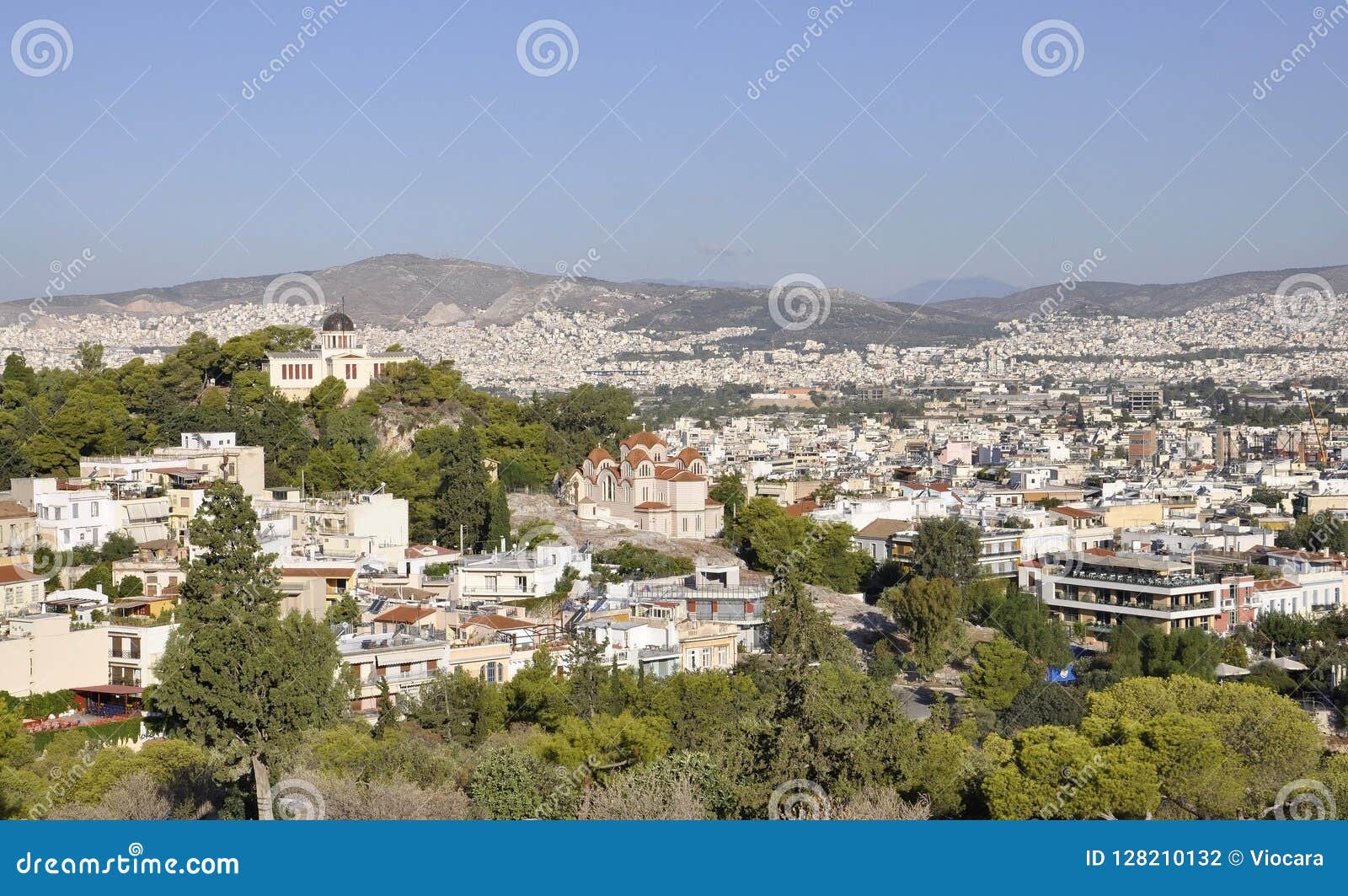 aerial view with byzantine cathedral of the holy trinity and telescope of national observatory from athens in greece