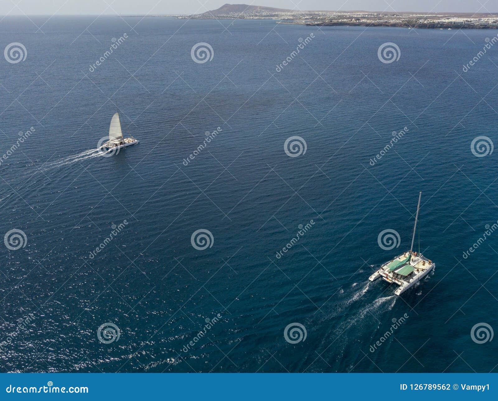 aerial view of a catamaran crossing the ocean waters. lanzarote, canaries, spain