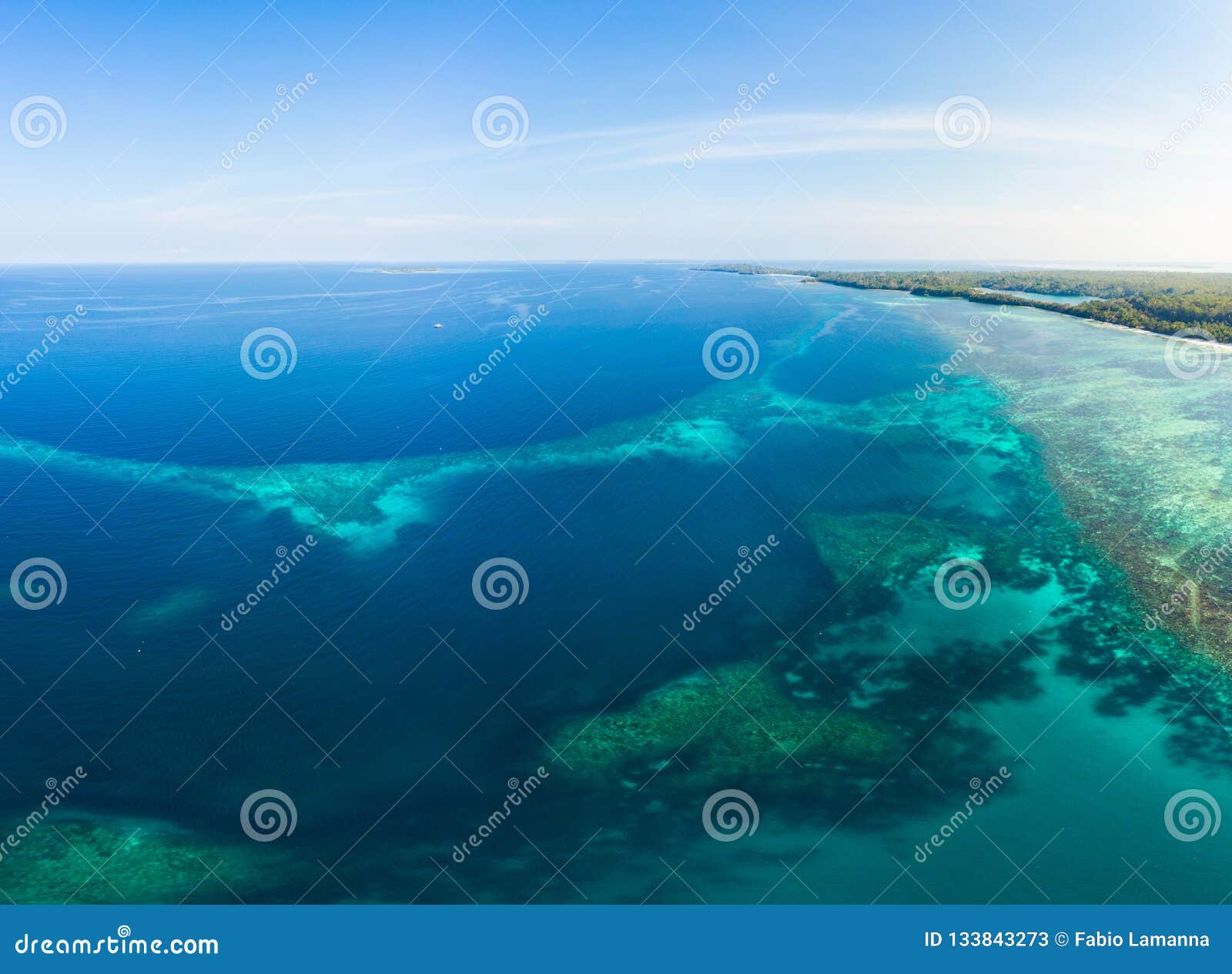 aerial view coral reef scattered in caribbean sea, tropical beach islands. indonesia moluccas archipelago, kei islands, banda sea