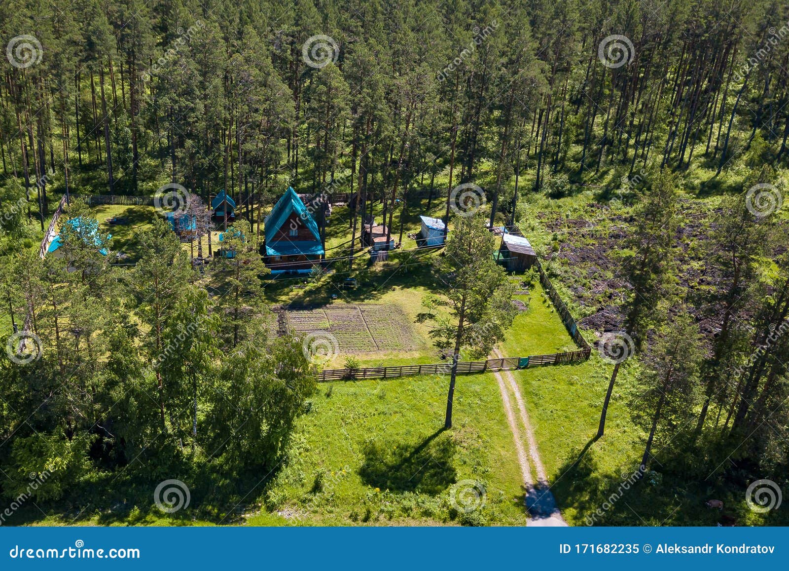Aerial View Of A Country House With A Garden And Greenhouses
