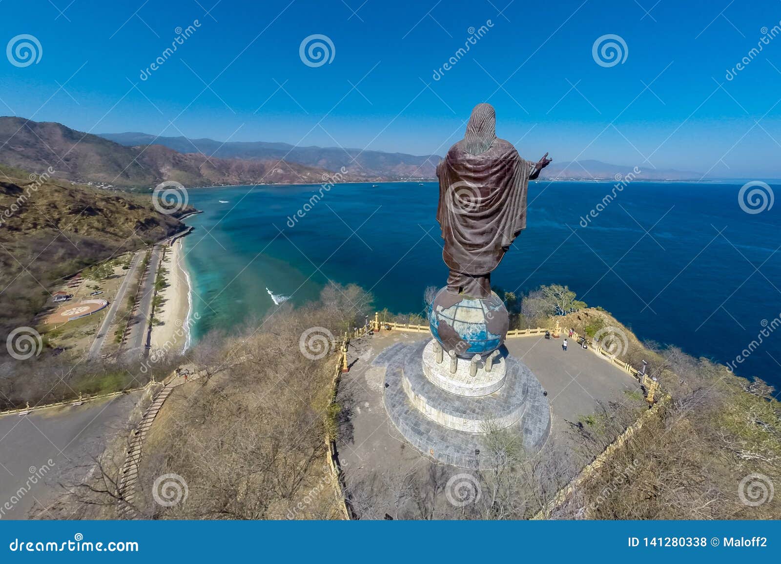 aerial view of cristo rei of dili, high statue of jesus christ located atop a globe in dili city, east timor. timor-leste.