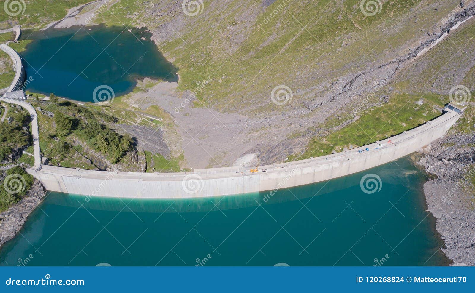 aerial view of the dam of the lake barbellino, an alpine artificial lake. italian alps. italy