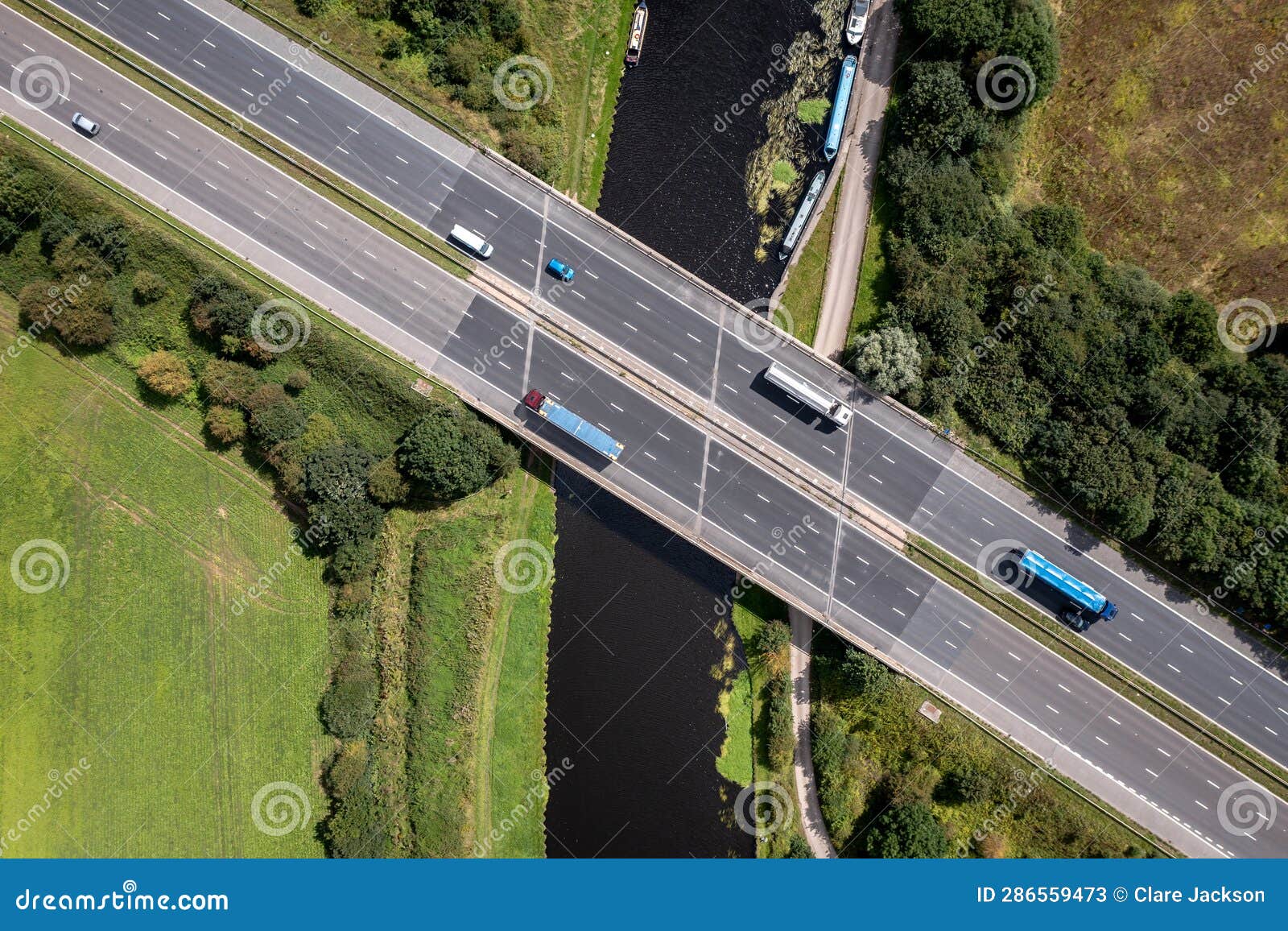 Aerial View Directly Above a Busy UK Motorway Bridge Over a River Stock ...