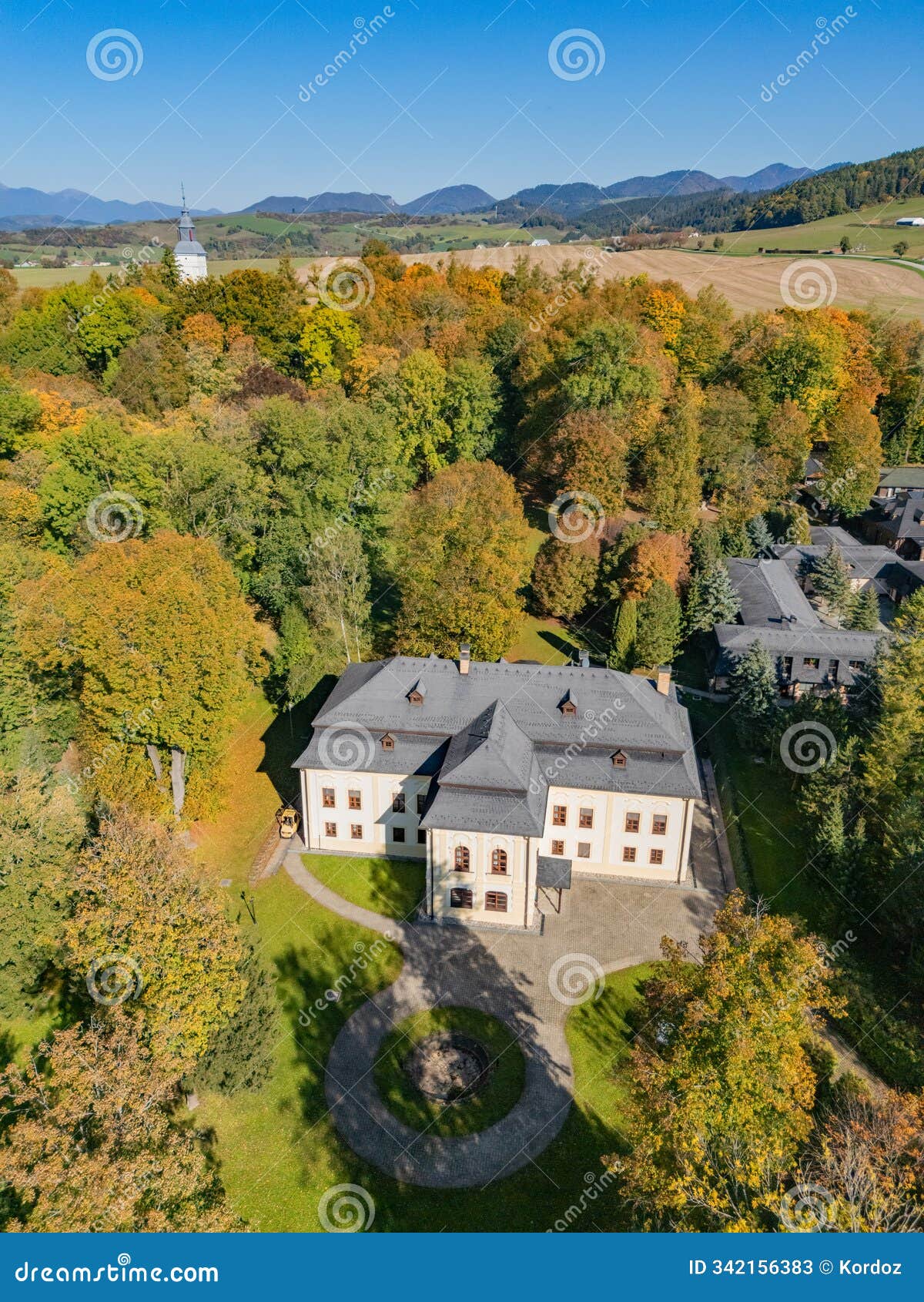 aerial view of dolny kastiel mansion in necpaly village in turiec region during autumn