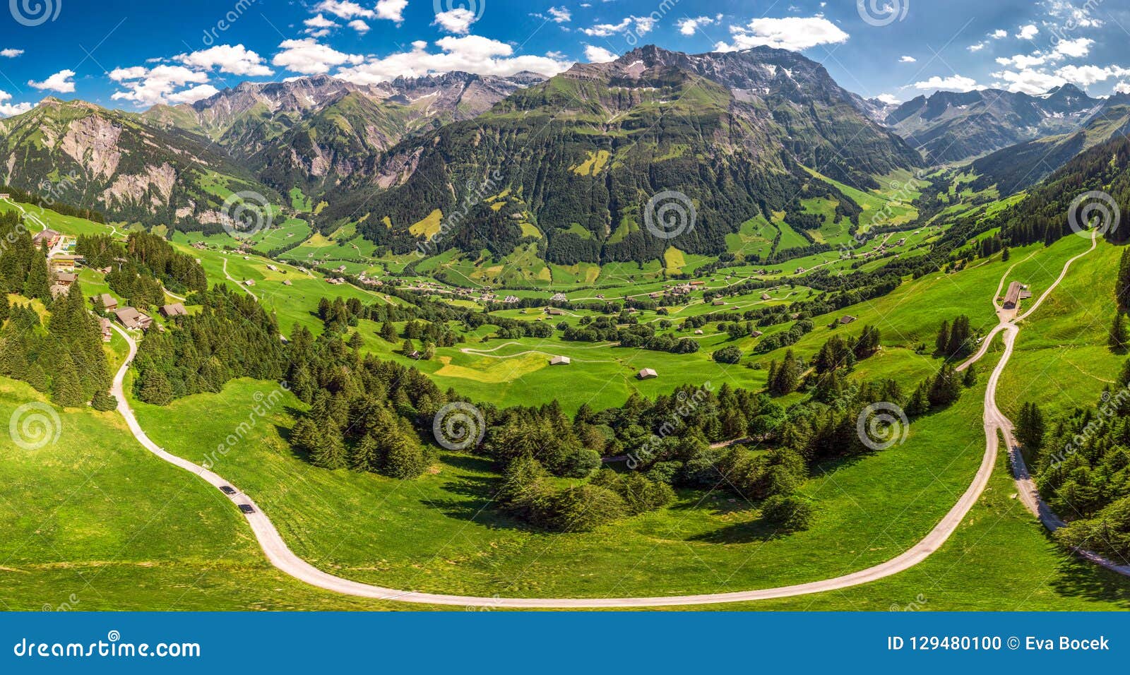 aerial view of elm village and swiss mountains - piz segnas, piz sardona, laaxer stockli from ampachli, glarus, switzerland, europ