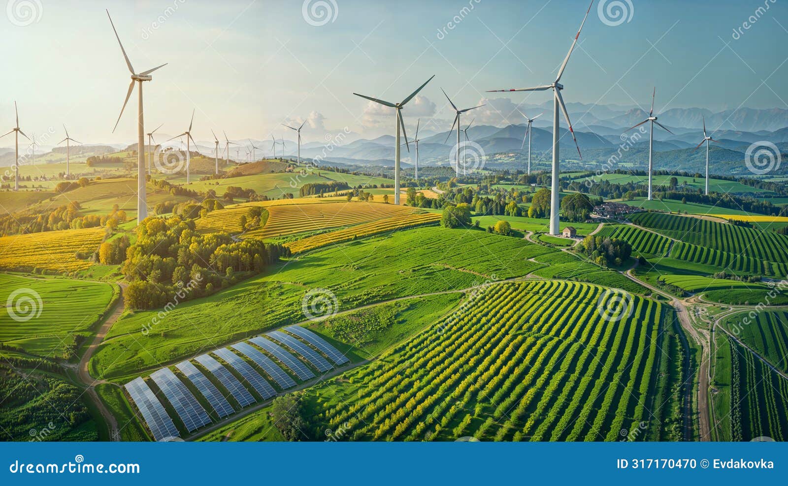 an aerial view of a farm with wind turbines generating renewable energy on a sunny day.