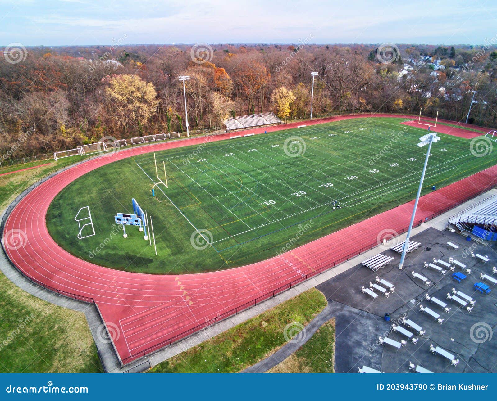 Aerial View of Football Field with Running Track Around the Perimeter