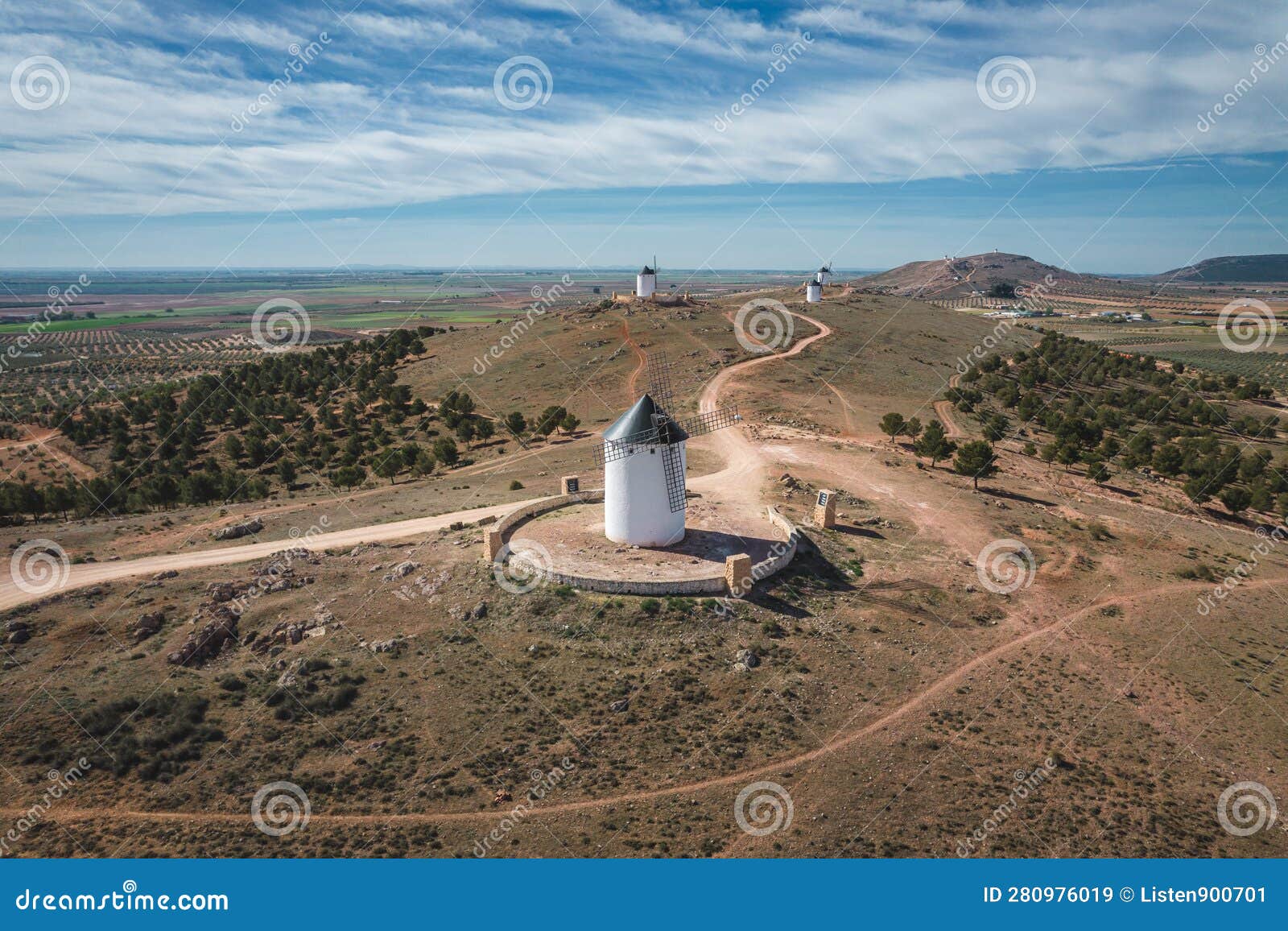 aerial view of the group of old historic windmills on the hill of herencia, consuegra, spain