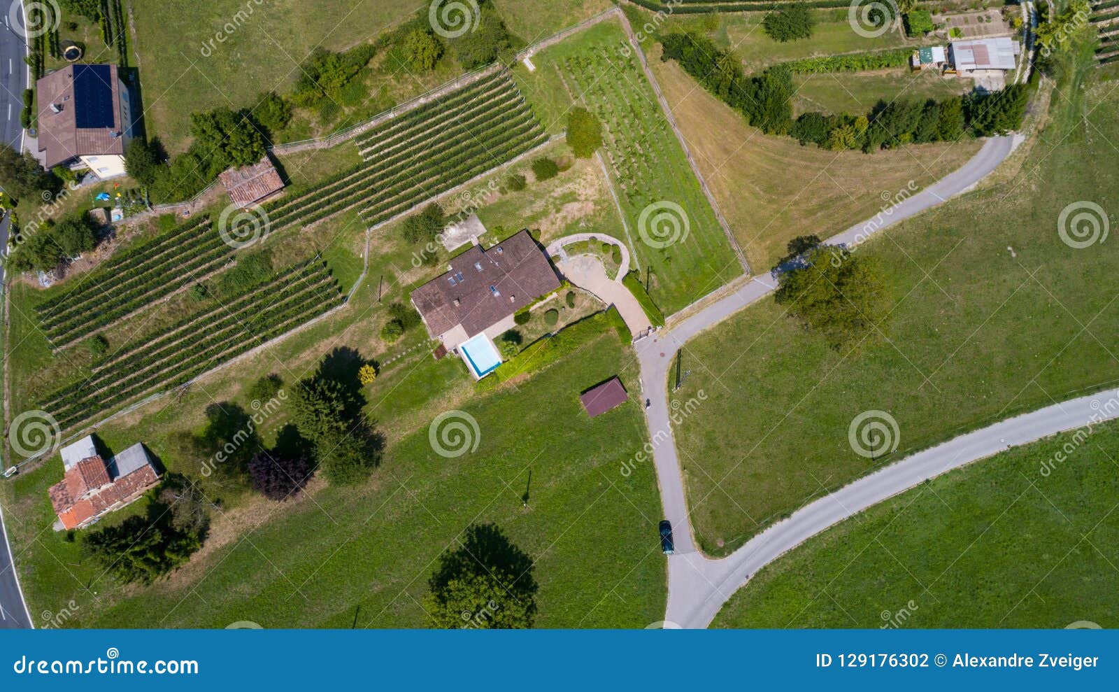 Aerial View Of House With Swimming Pool In The Countryside