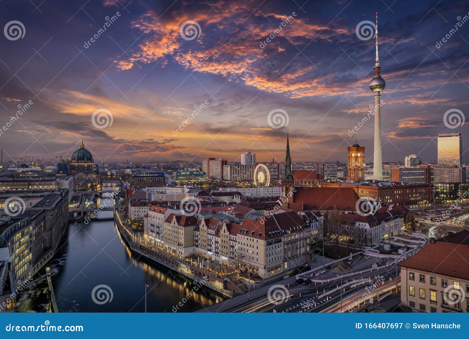 aerial view of the illuminated berlin skyline and spree river during beautiful sunset