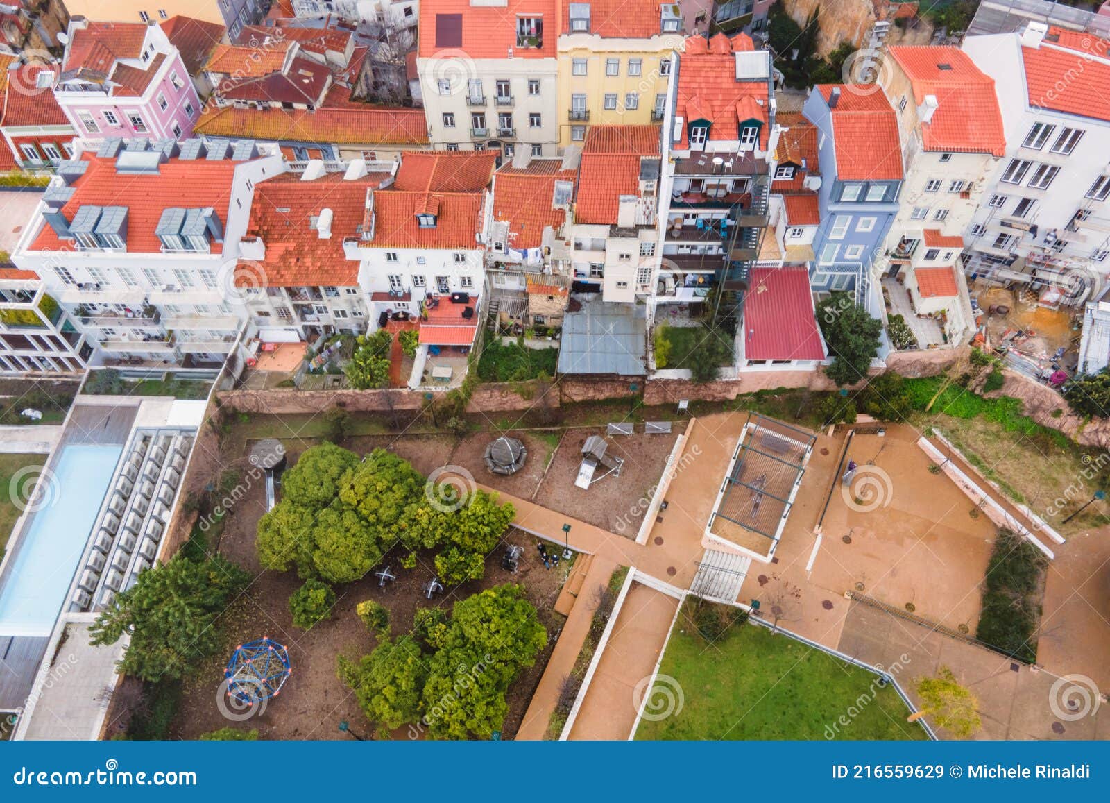 aerial view of jardim de cerca da graca, a panoramic park with cafe and play area over lisbon old town skyline, lisbon, portugal