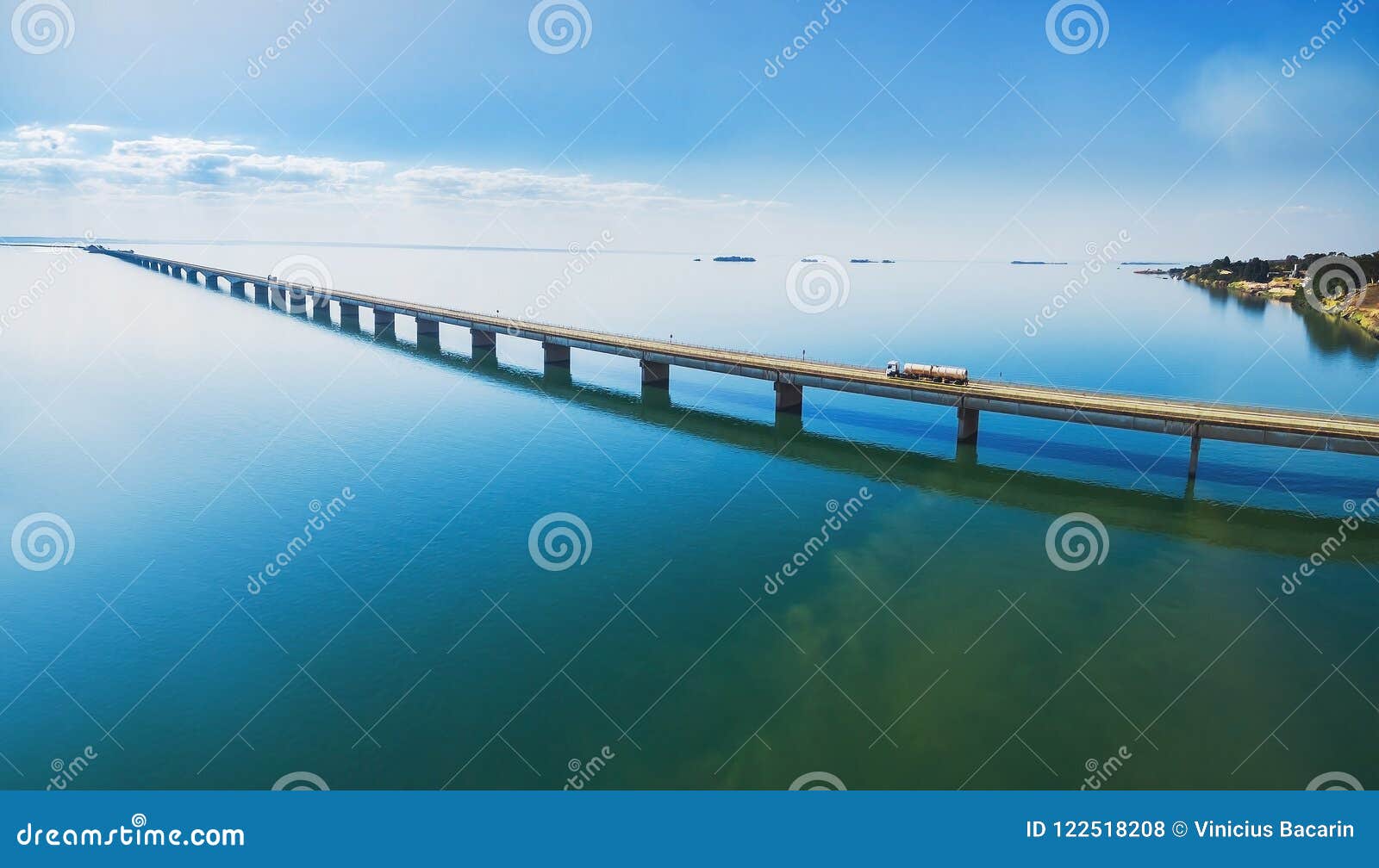 aerial view of a long highway bridge above a river.