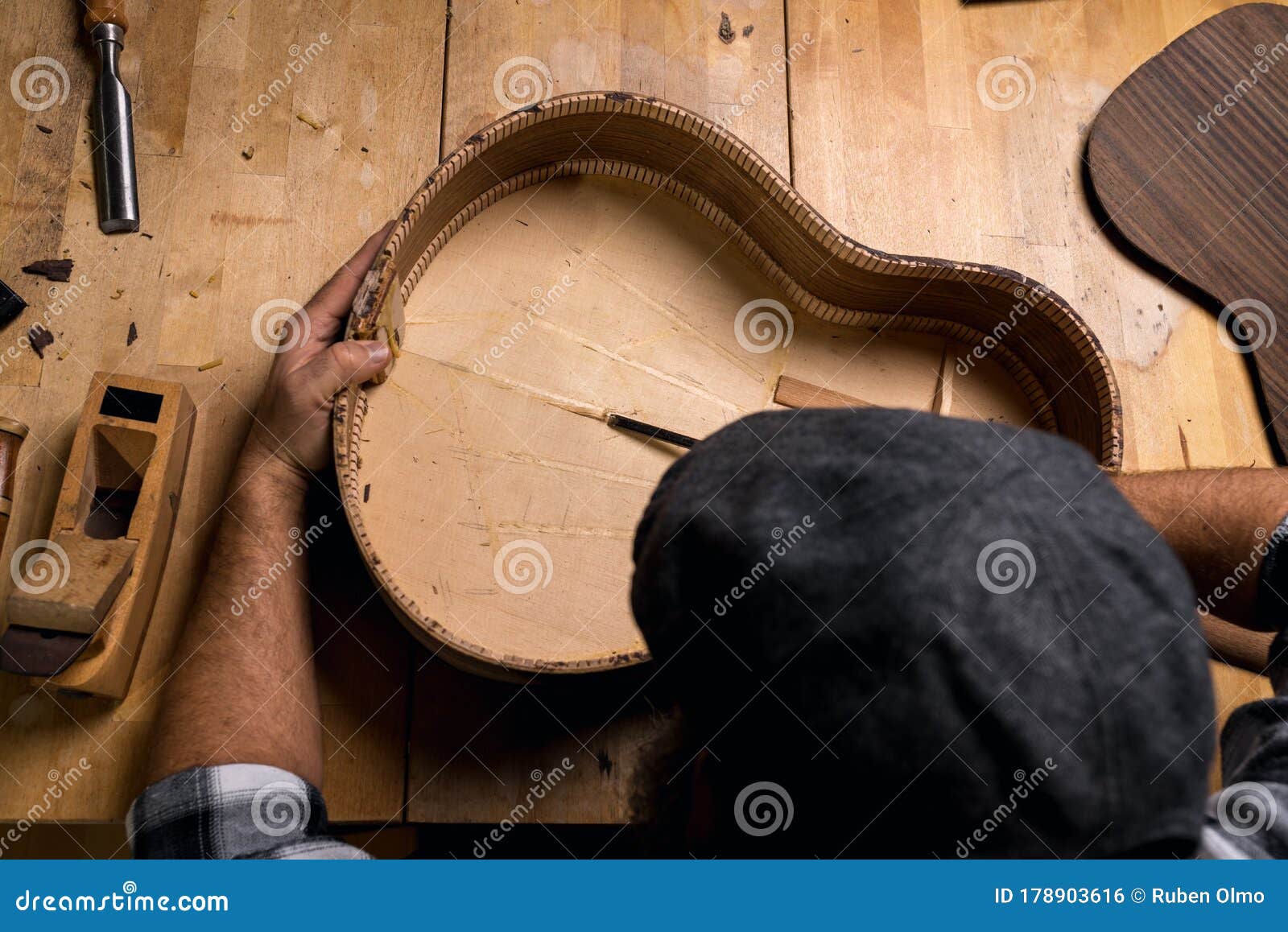 Luthier Table Top View With Classical Guitar And Tools. Craftsman