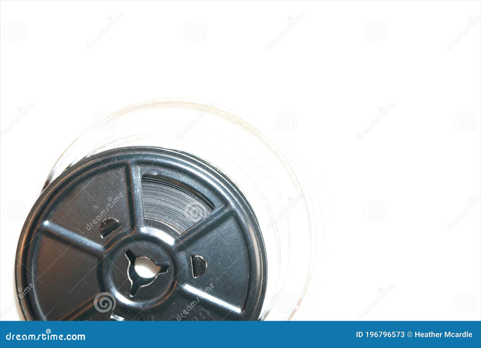 Vintage Metal Reel of 8mm Film Uncoils Against Negative Space Stock Image -  Image of industry, creativity: 196796573