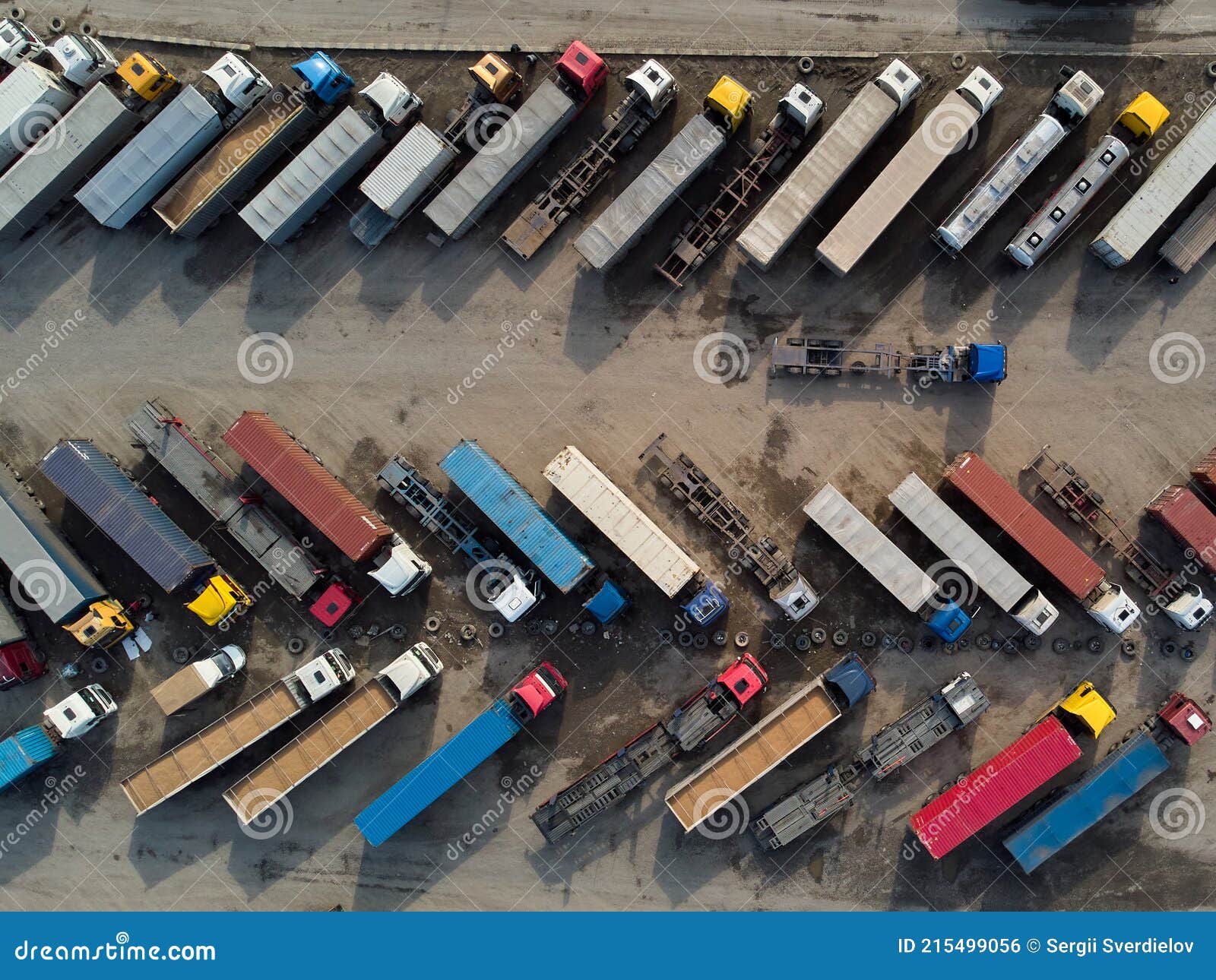 Aerial View of a Parking Lot of Trucks Ready for Loading Containers and