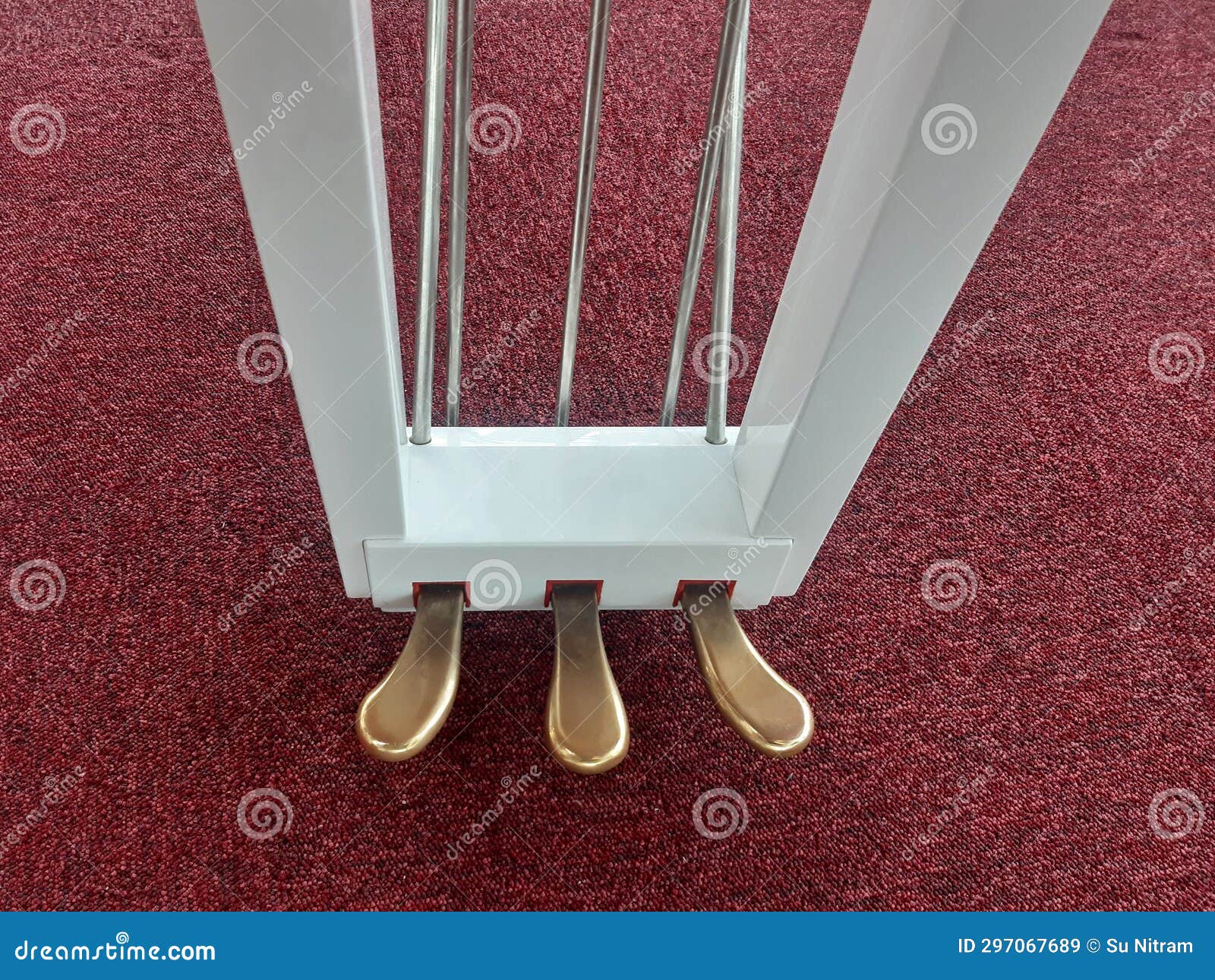 aerial view of piano pedals. three piano levers to create musical effects. close up of sustain, soft and sostenuto pedal. parts of