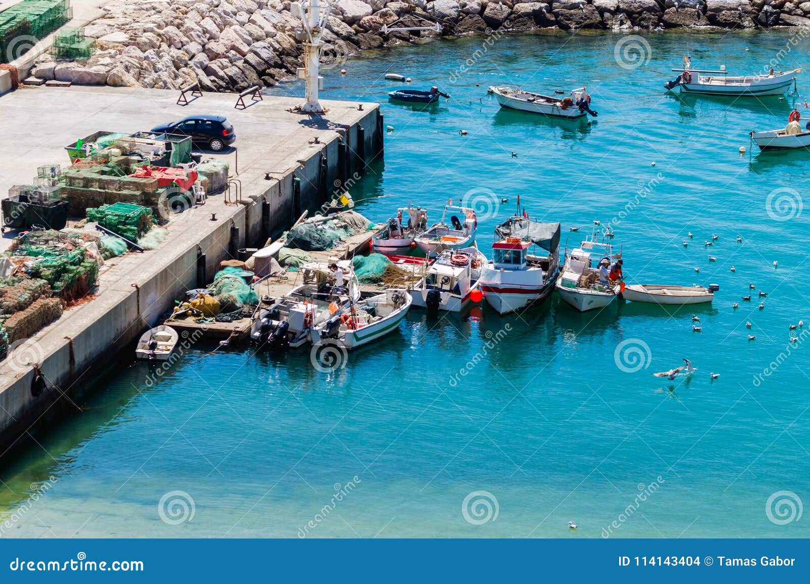 aerial view of fihsing boats in the porto de abrigo de albufeira, albufeira bay in albufeira, portugal