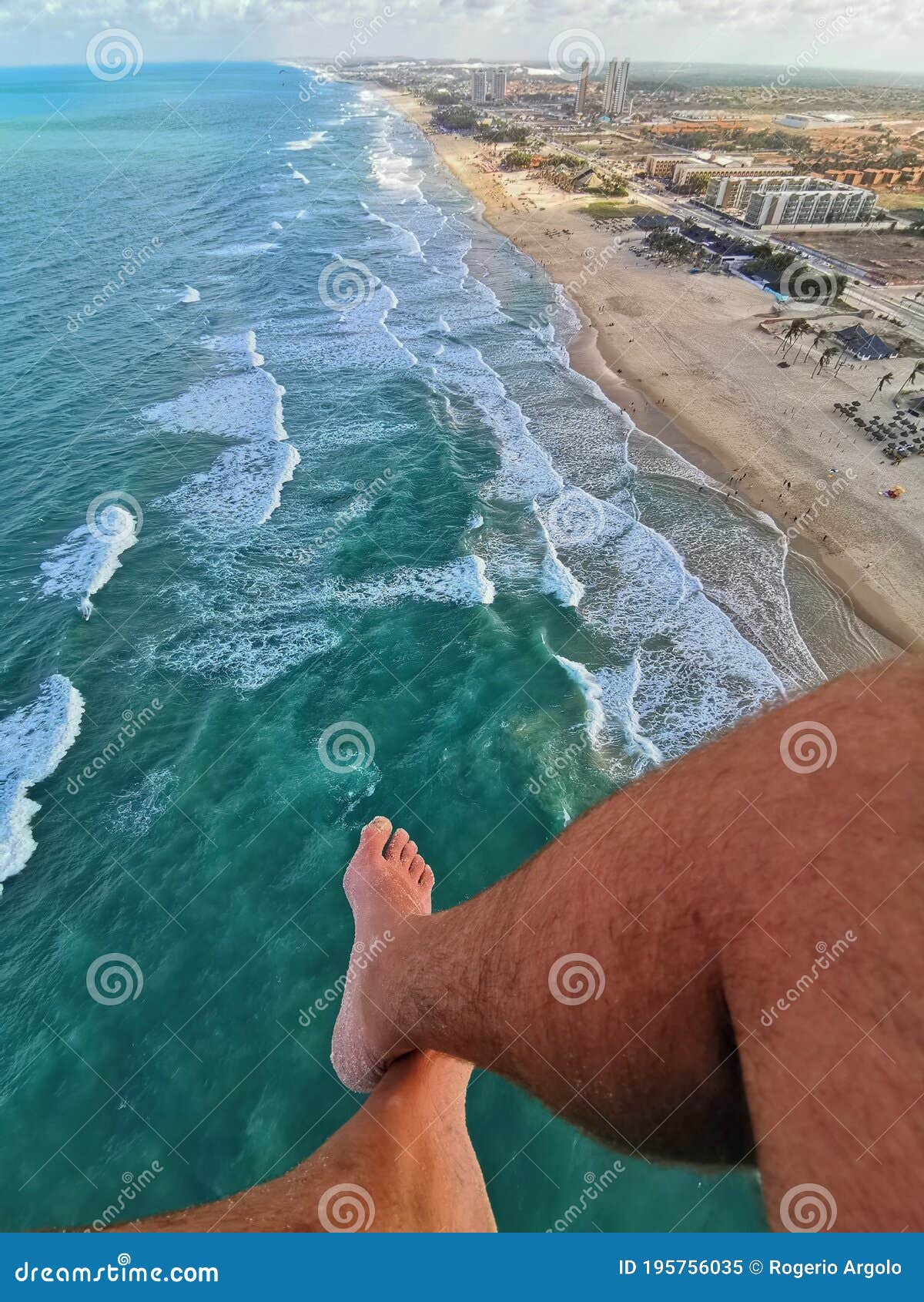 aerial view of praia do futuro beach, fortaleza, cearÃÂ¡ brazil from a paraglider flight, legs showing..