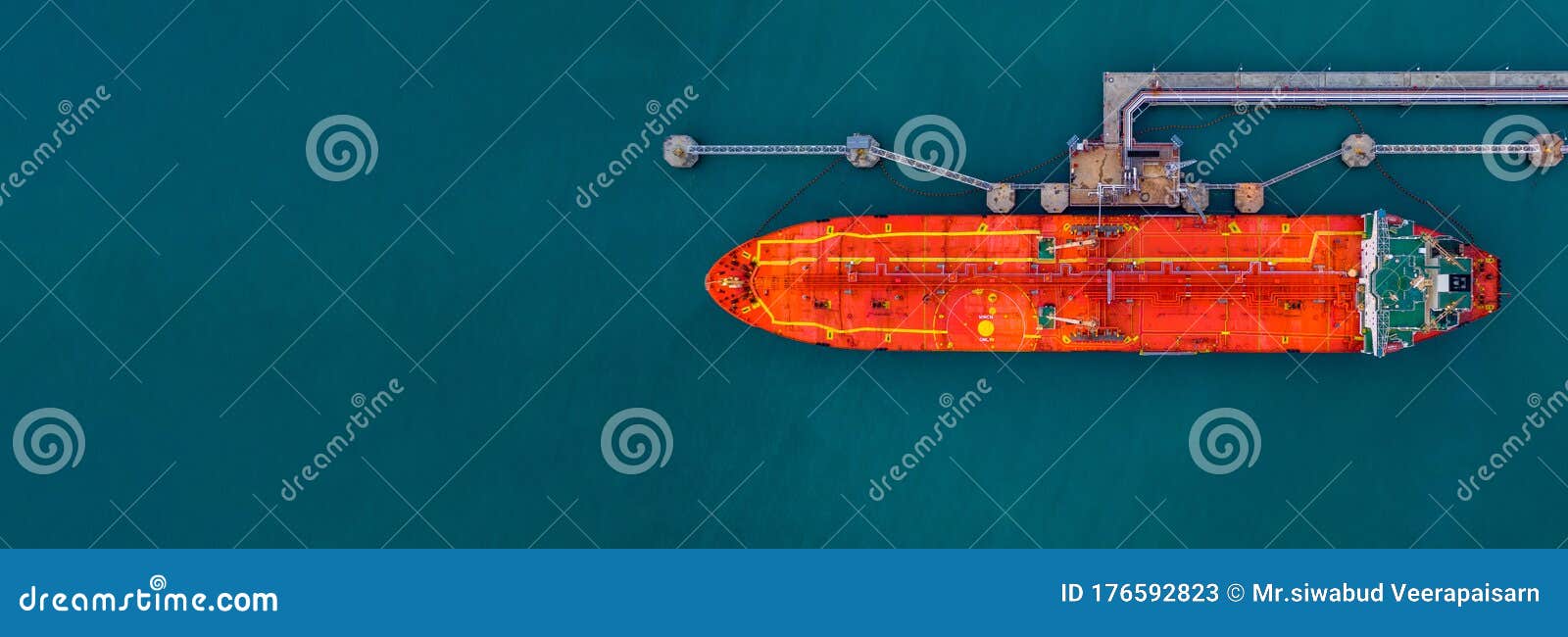 aerial view red cargo tanker ship vessel at port with marine loading arms, global business oversea commercial trade logistic