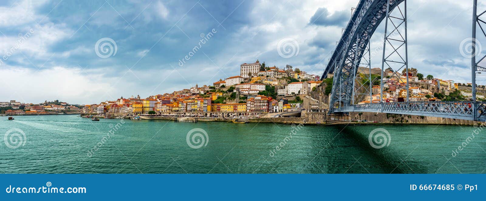 panorama view of ribeira and at dom luis bridge at oporto, portugal