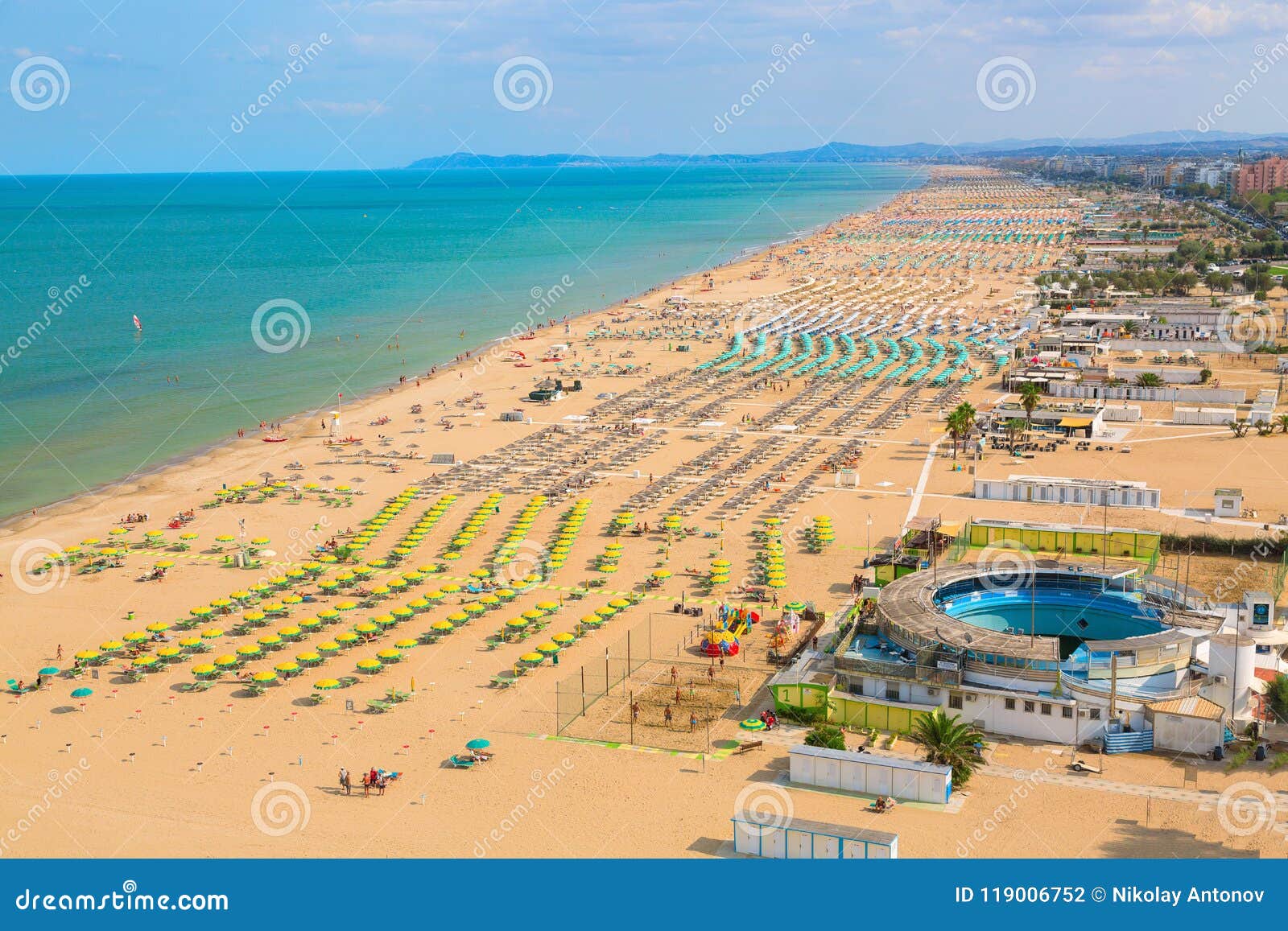 aerial view of rimini beach with people and blue water. summer vacation concept.